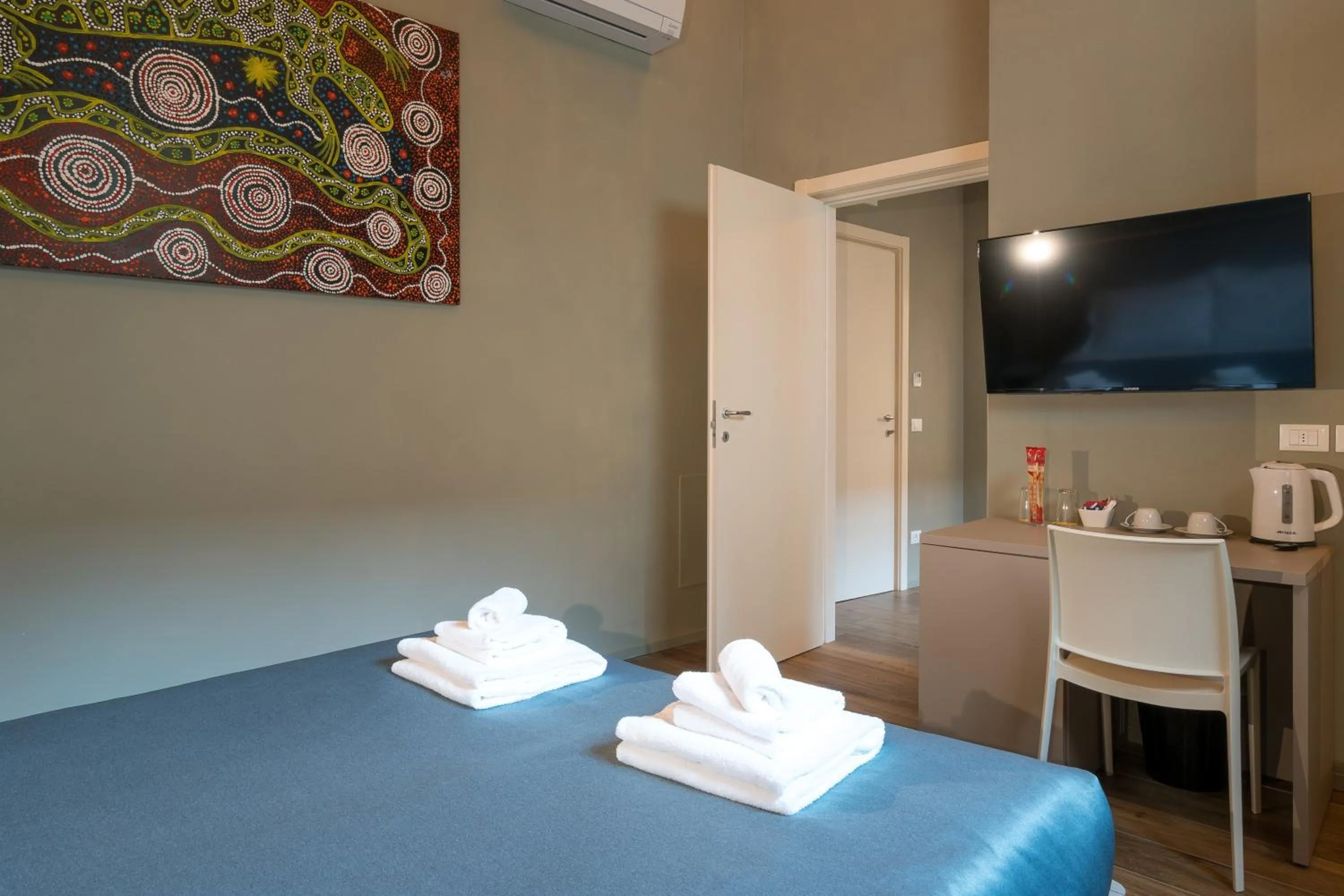 Bed in GOGO` Petit Hotel