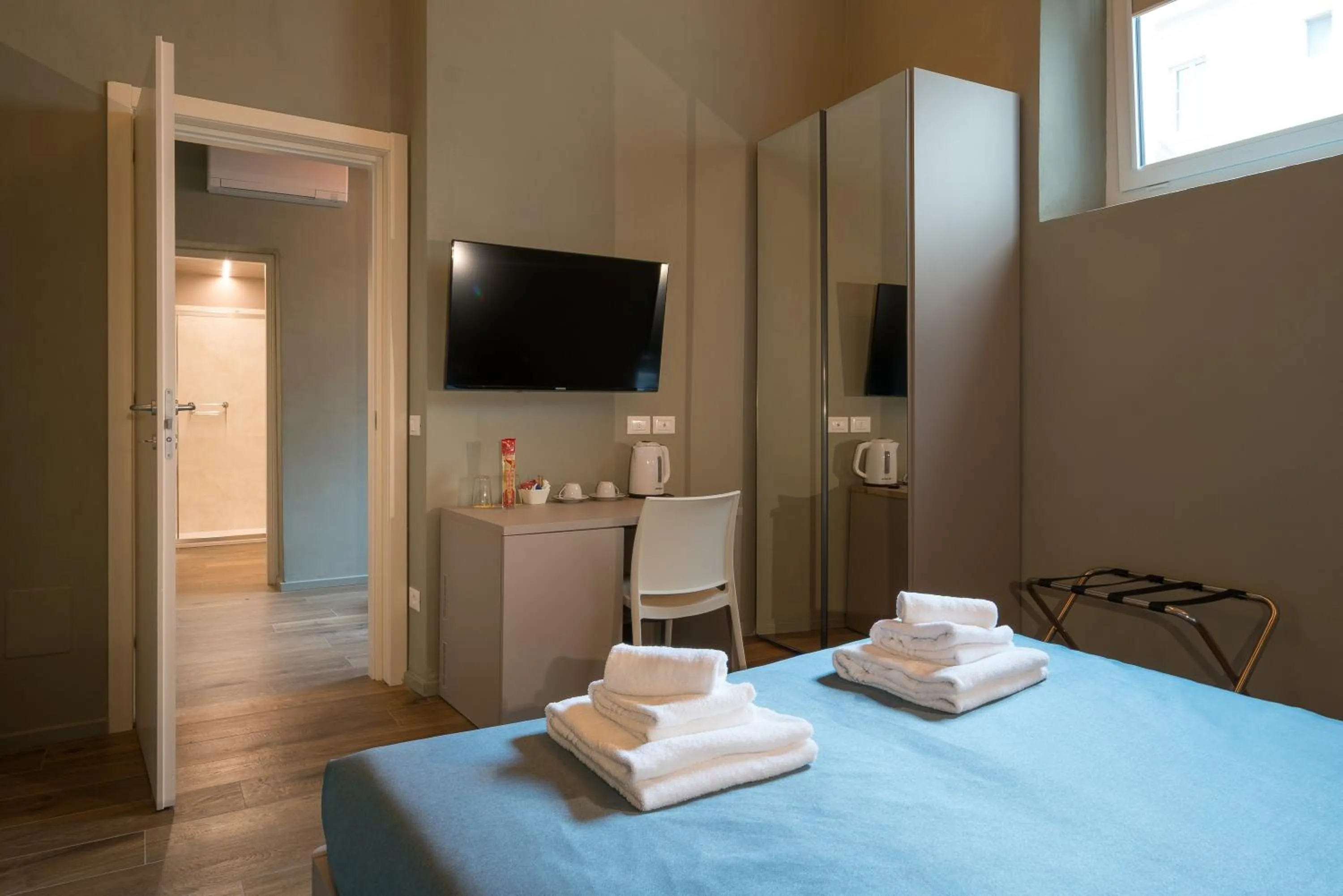 Bed in GOGO` Petit Hotel