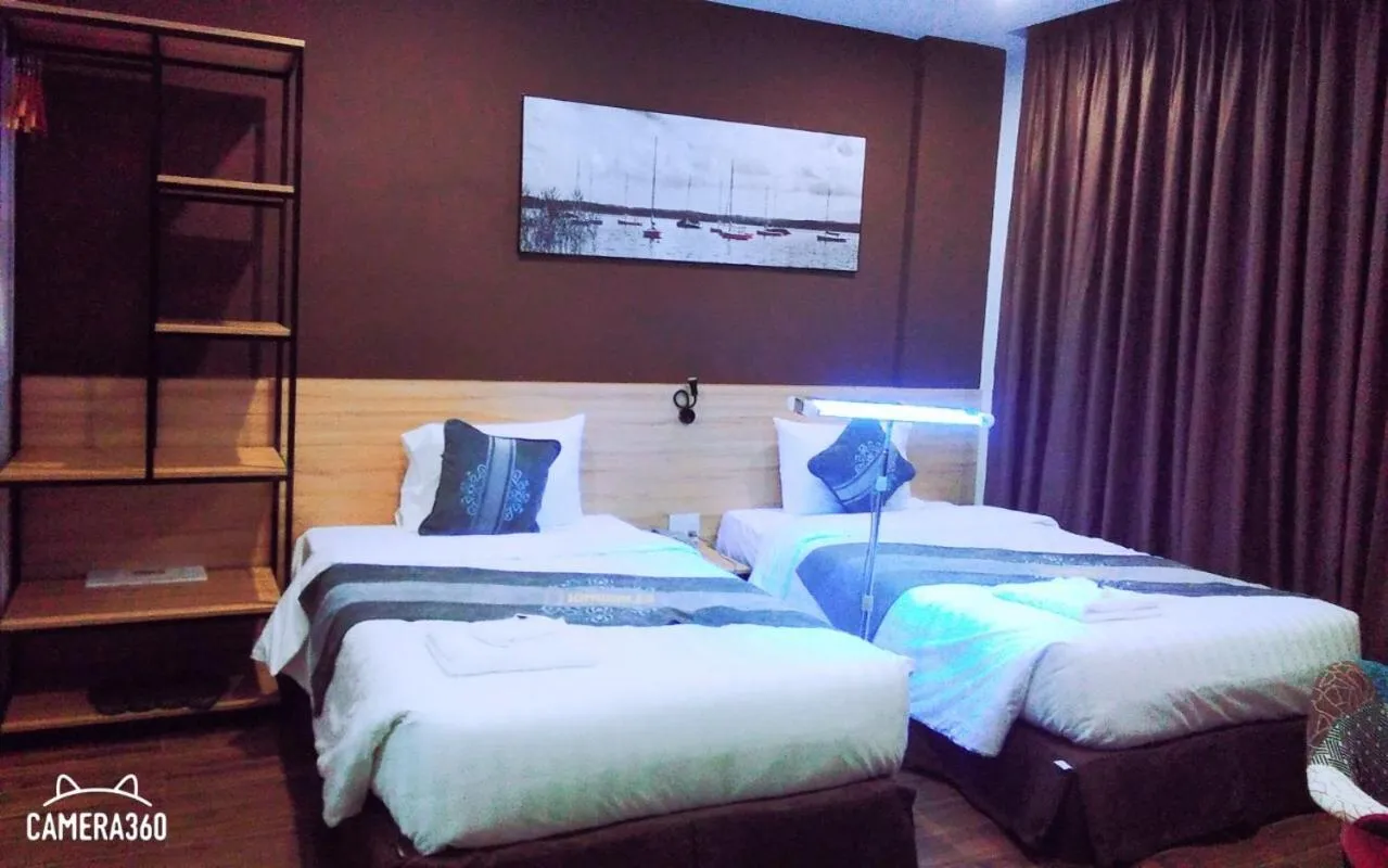 Bed in KingSales Hotel