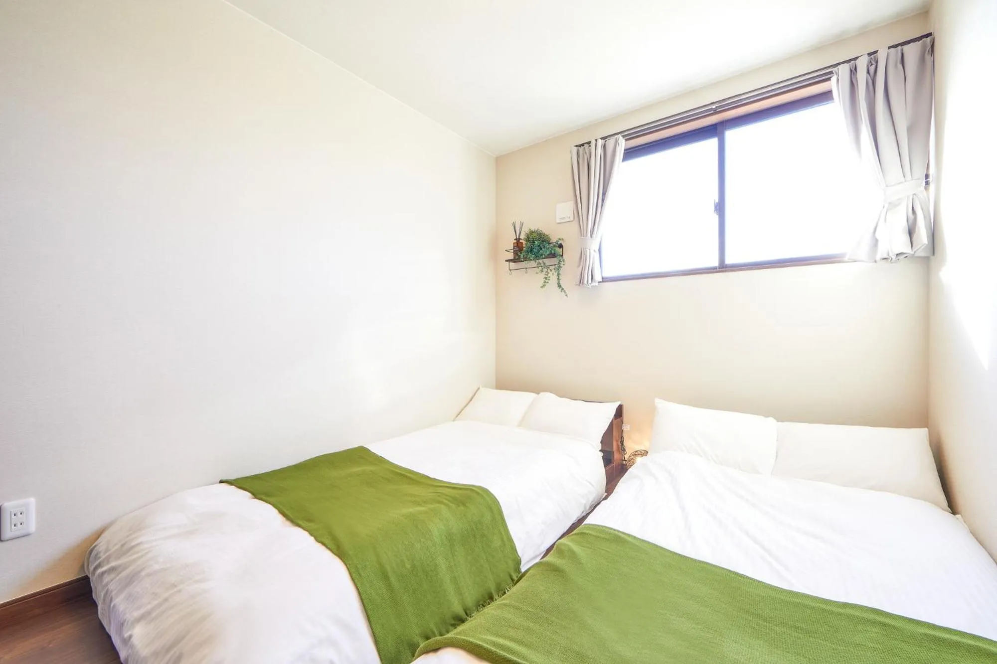 Bed in E-horizon Resort コンドミニアム名護B