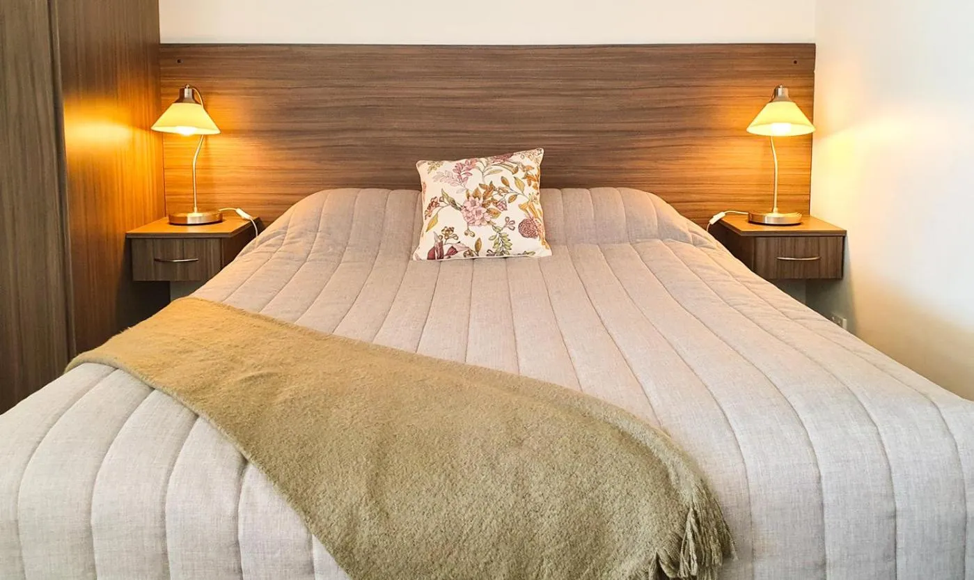 Bed in Motel Riverbend