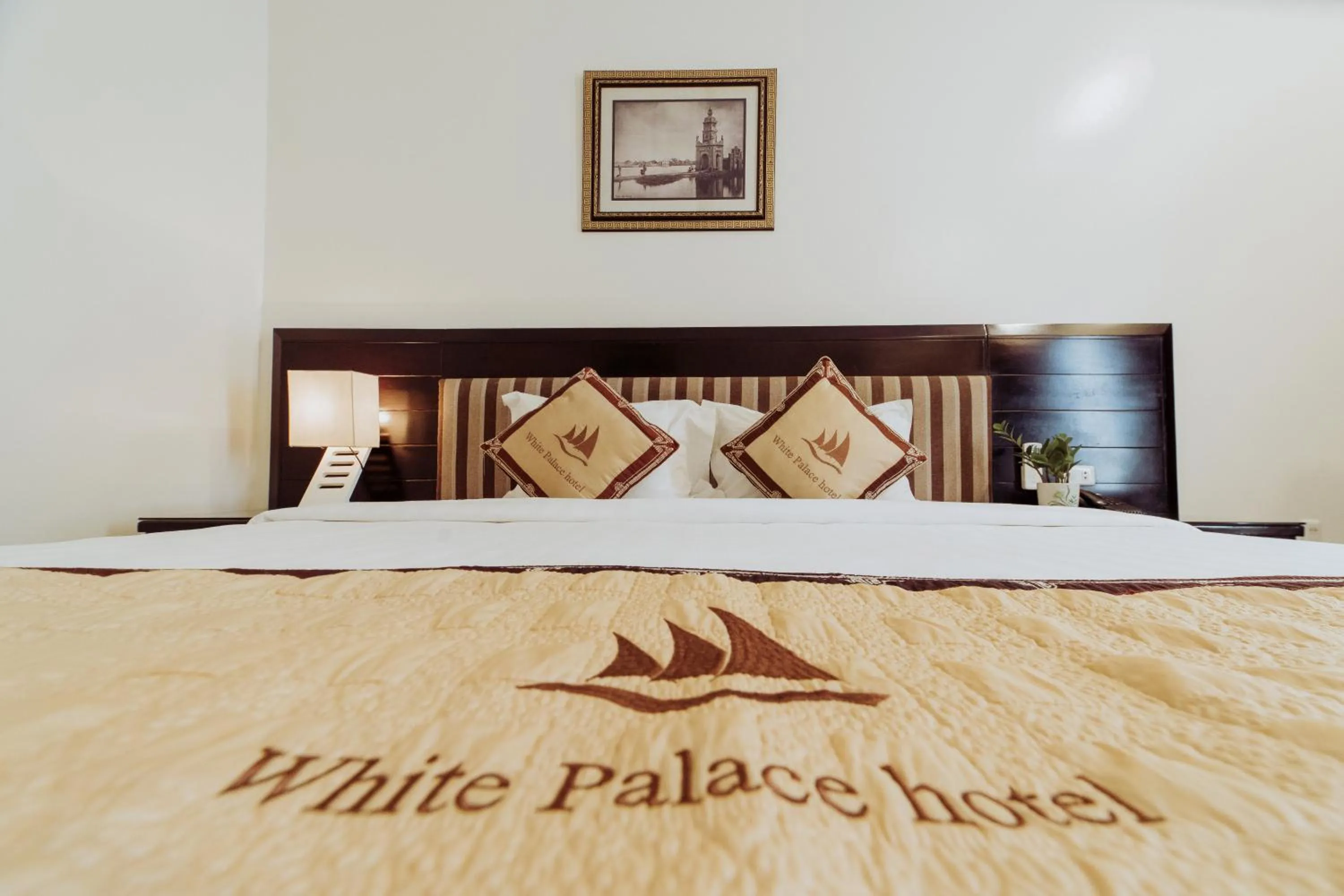 Bed in White Palace Thai Binh Hotel