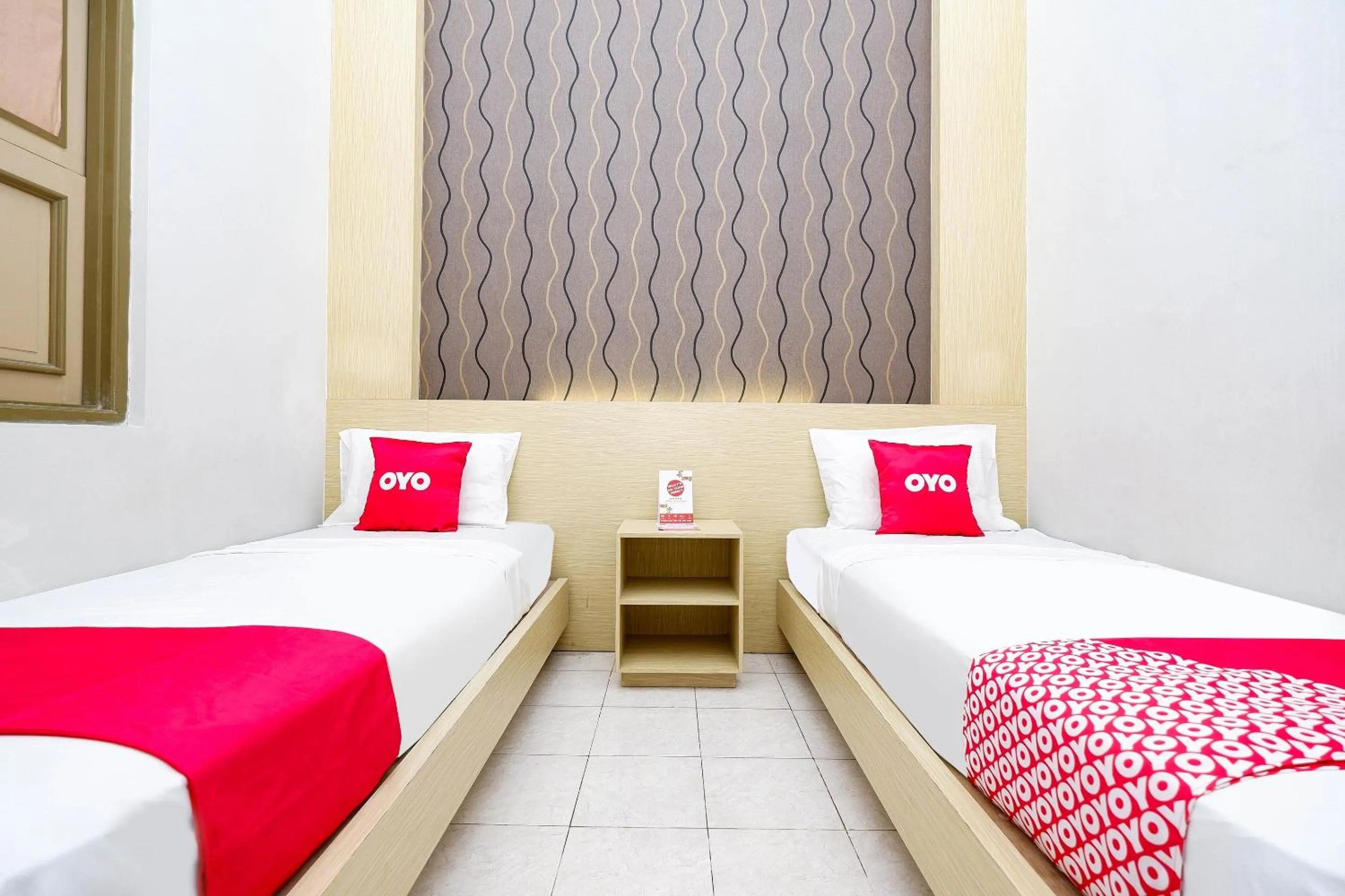 Bedroom in Super OYO 2436 Hotel Kencana