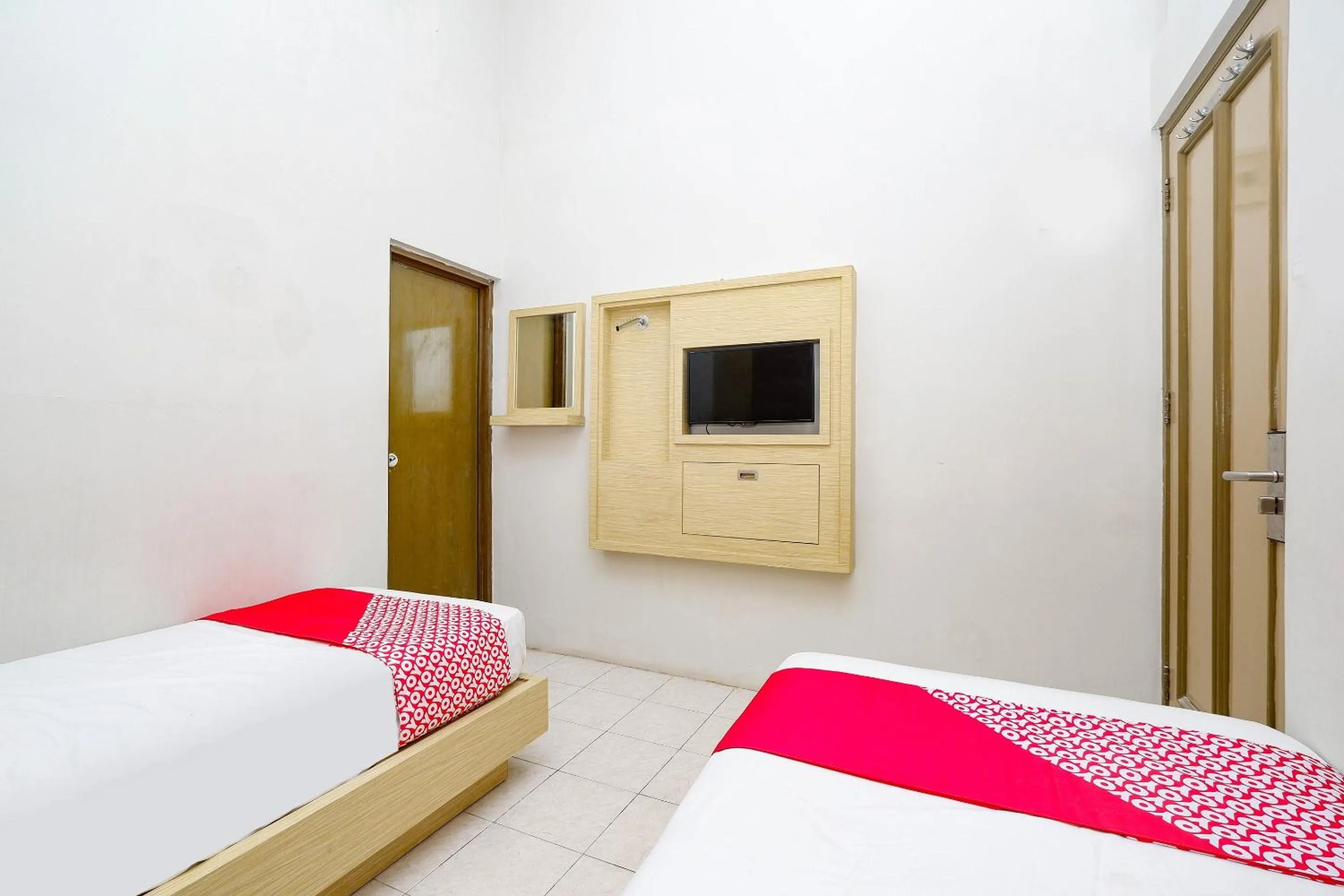 Bedroom in Super OYO 2436 Hotel Kencana