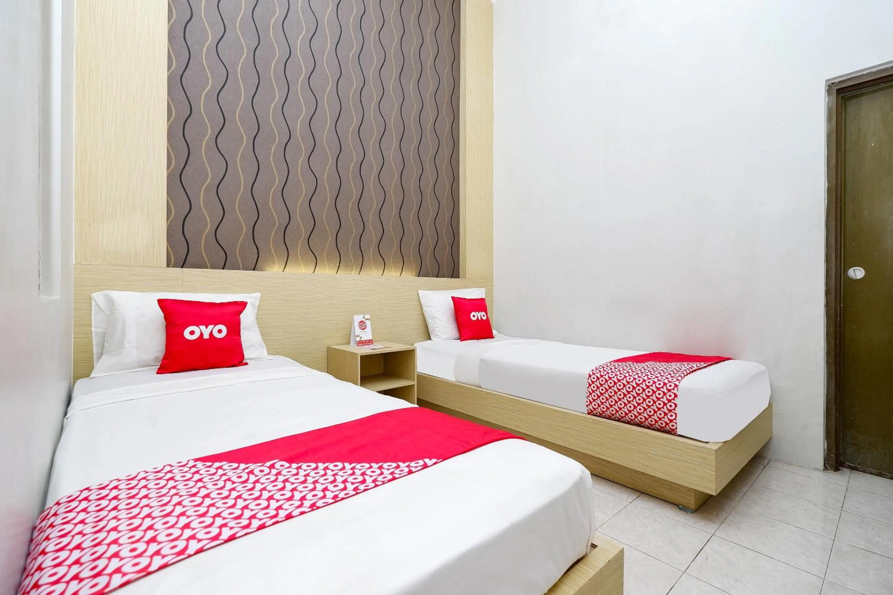 Bedroom in Super OYO 2436 Hotel Kencana