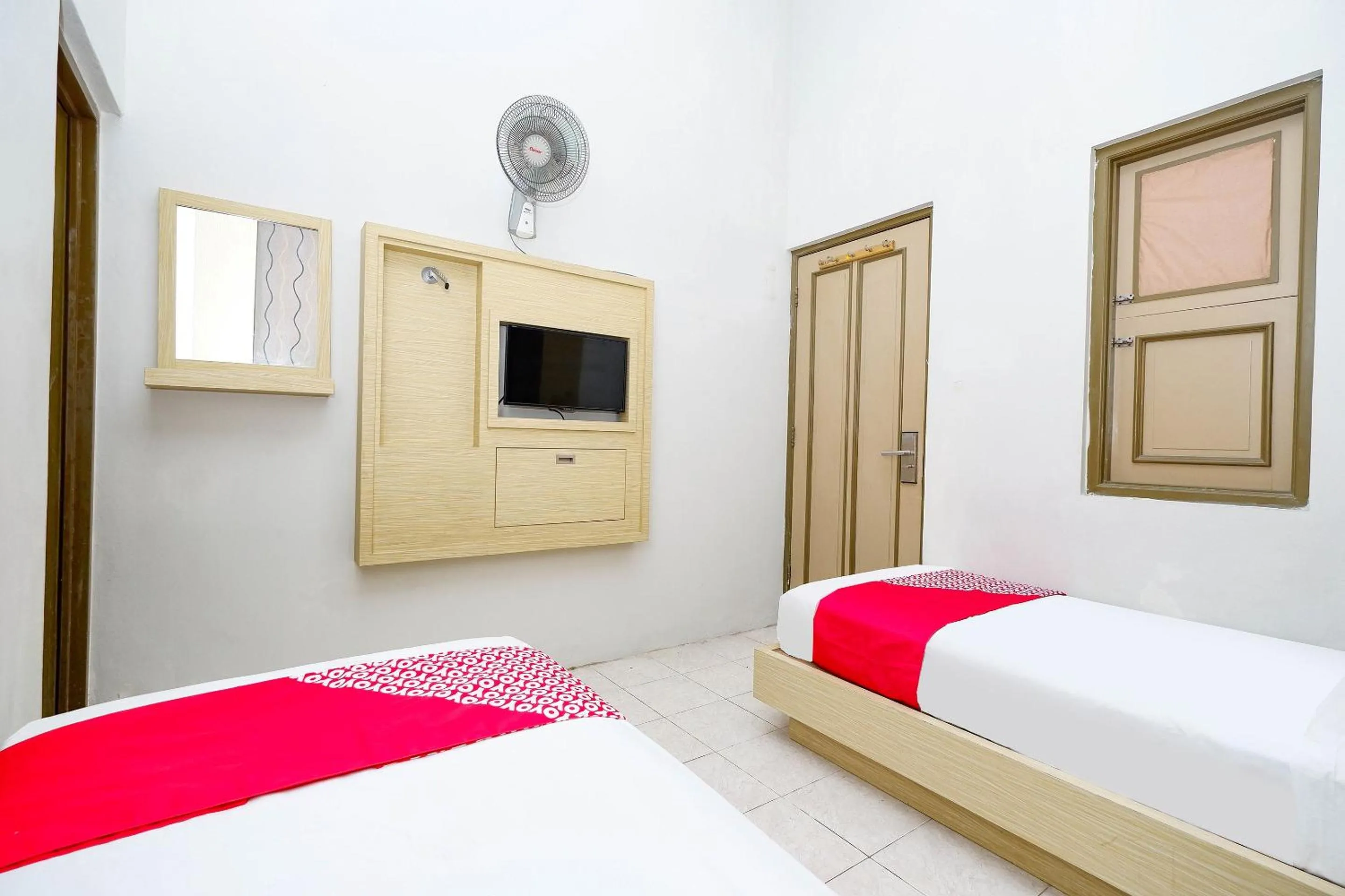 Bedroom in Super OYO 2436 Hotel Kencana