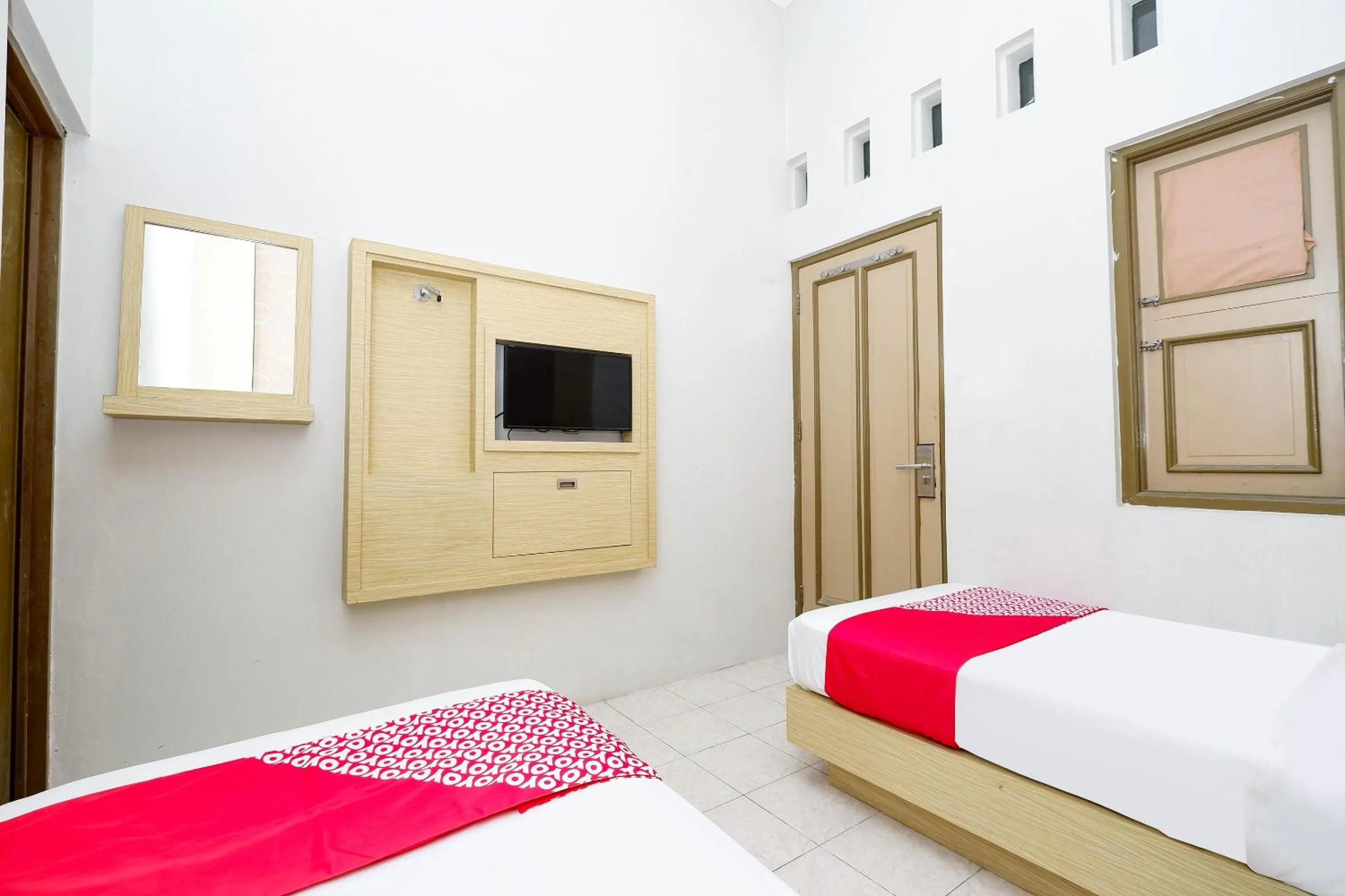 Bedroom in Super OYO 2436 Hotel Kencana