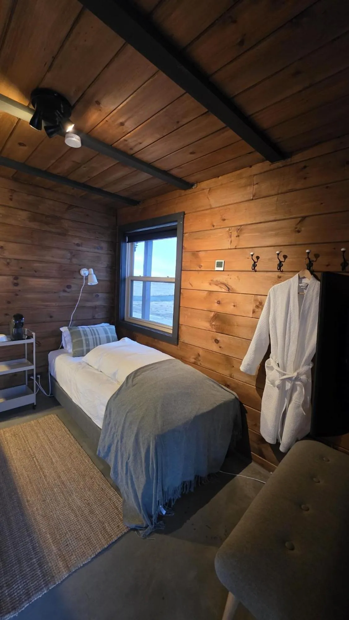 Bed in Riverfront Lodge Hella