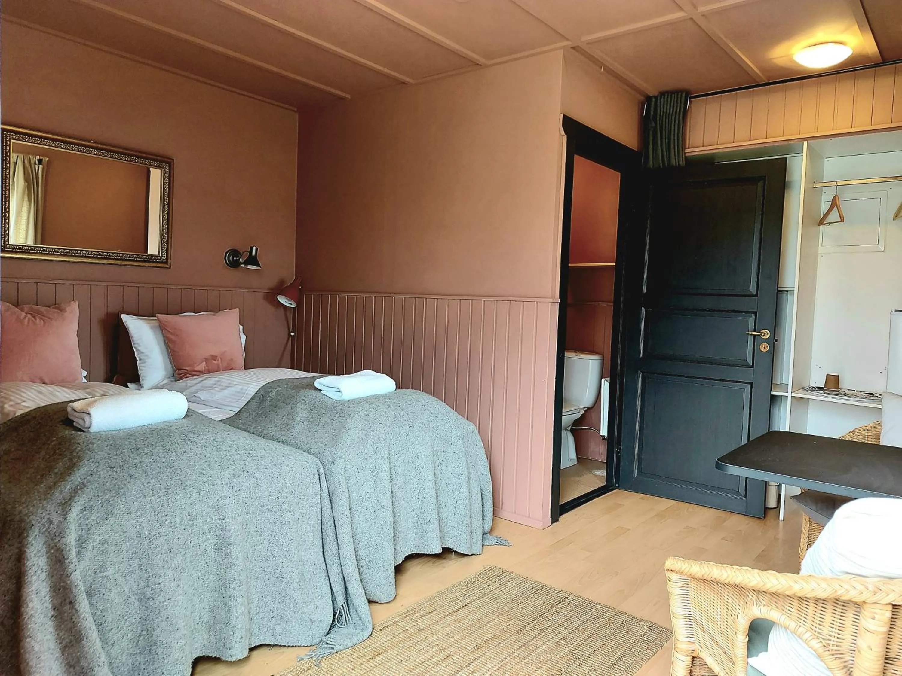 Bed in Riverfront Lodge Hella