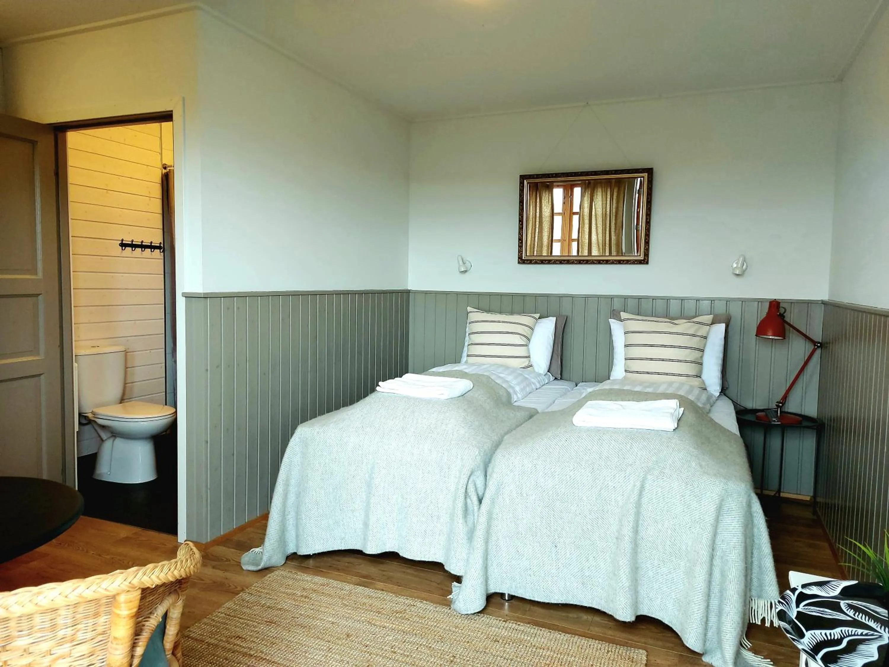 Bed in Riverfront Lodge Hella