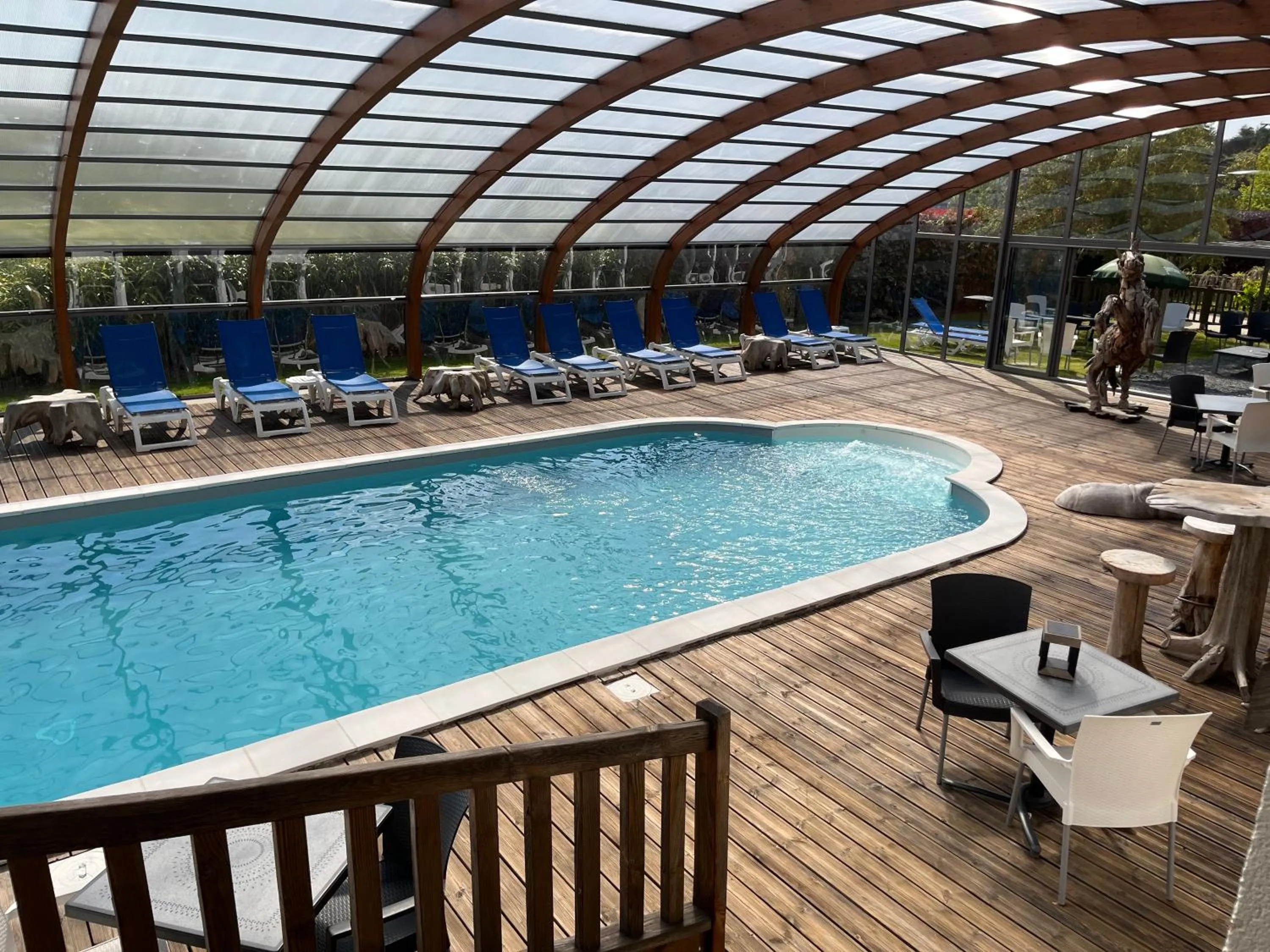 Swimming pool in The Originals Boutique Hôtel Spa Beuzeville Honfleur Sud