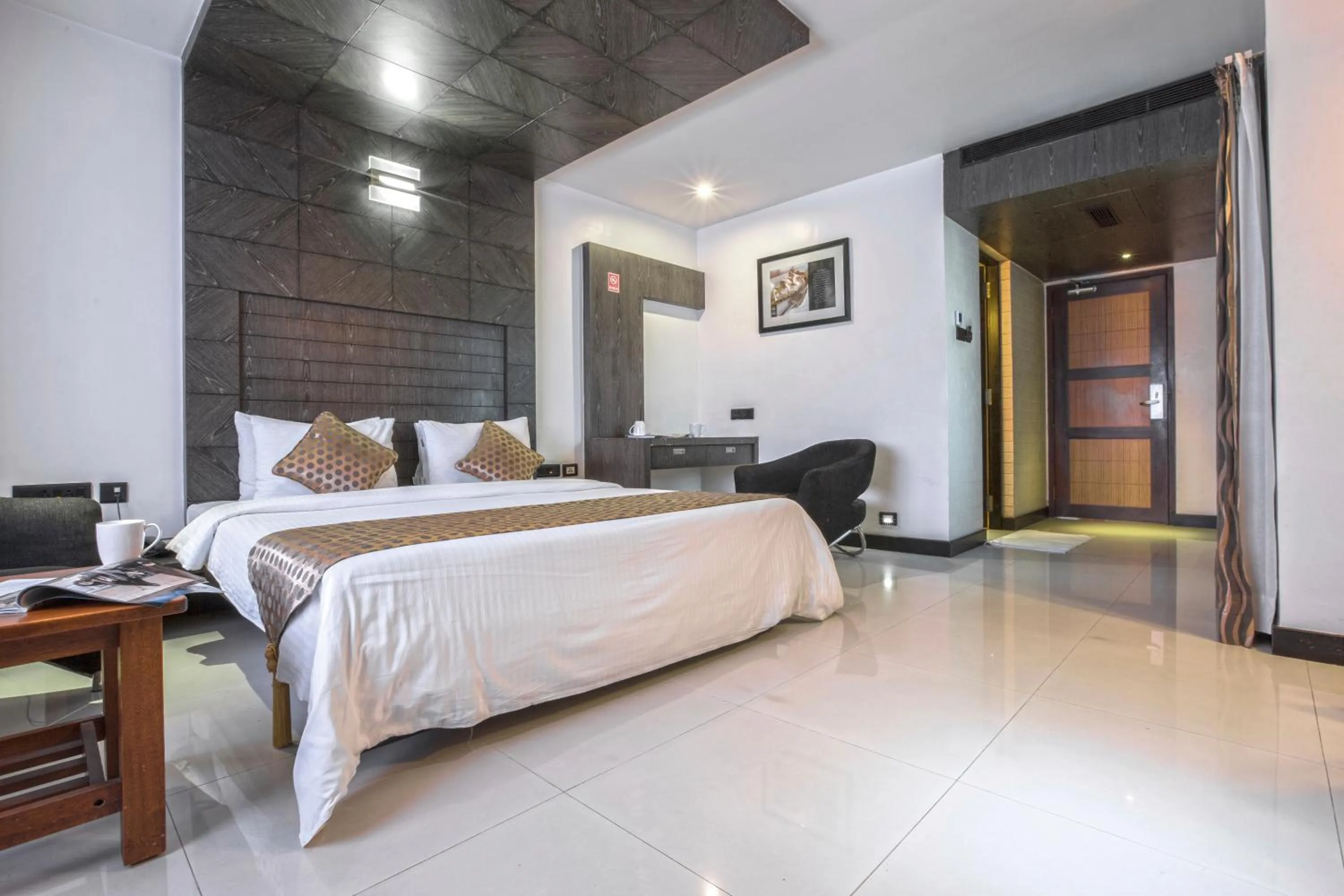 Seating area, Bed in THE CASTELLO RESIDENCY