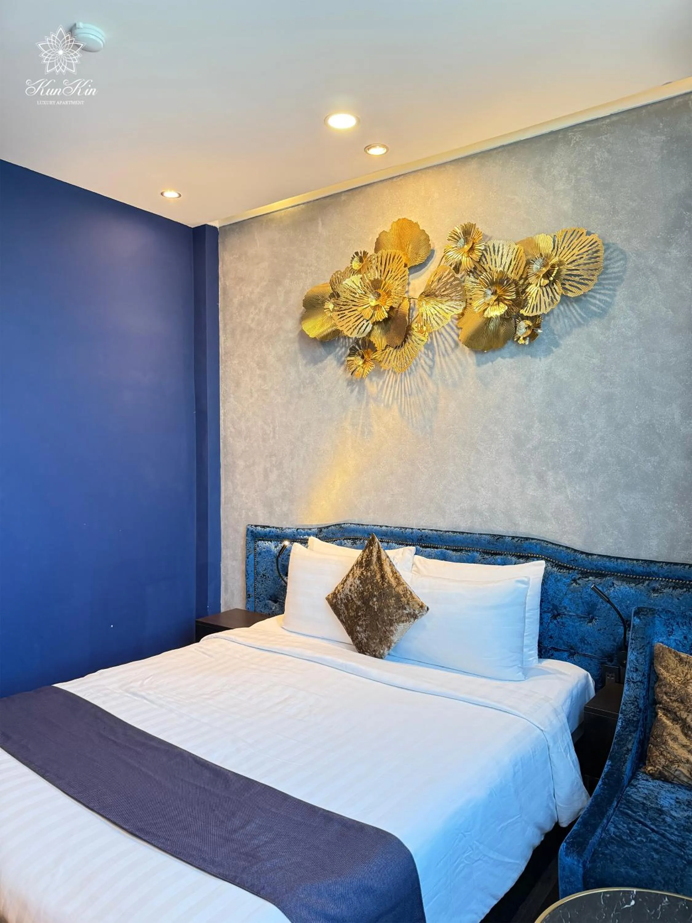 Bed in KunKin Luxury Hotel & Apartment