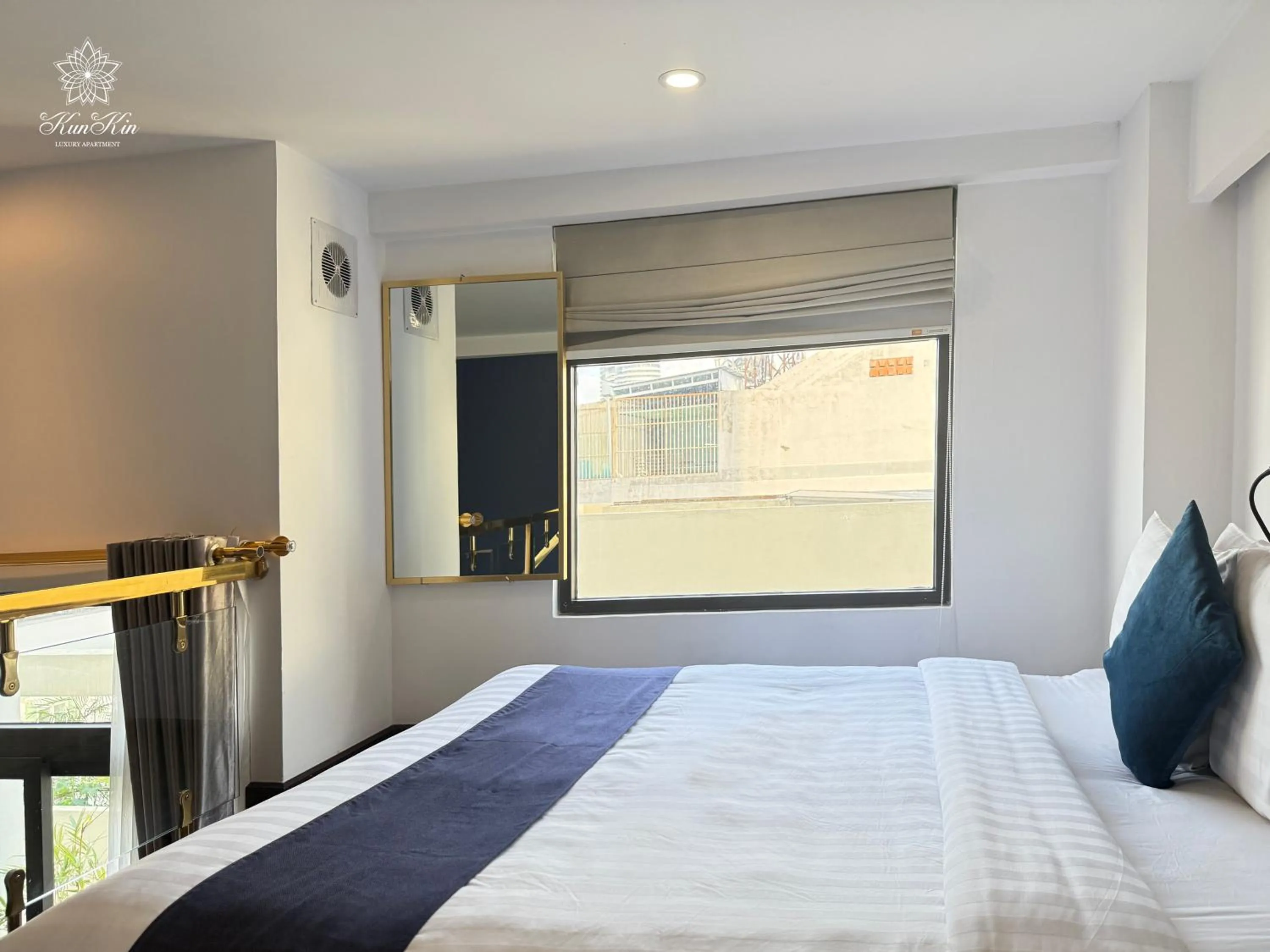Bed in KunKin Luxury Hotel & Apartment