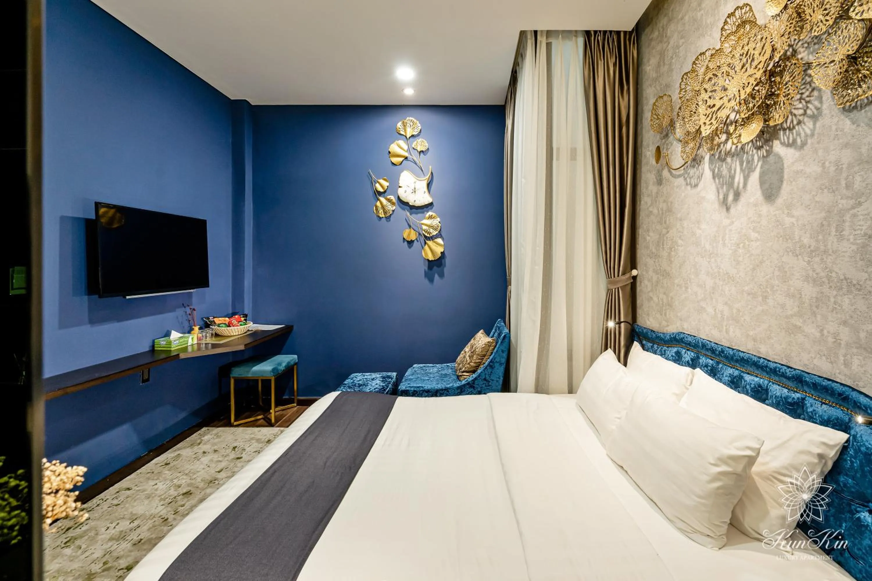 Bed in KunKin Luxury Hotel & Apartment