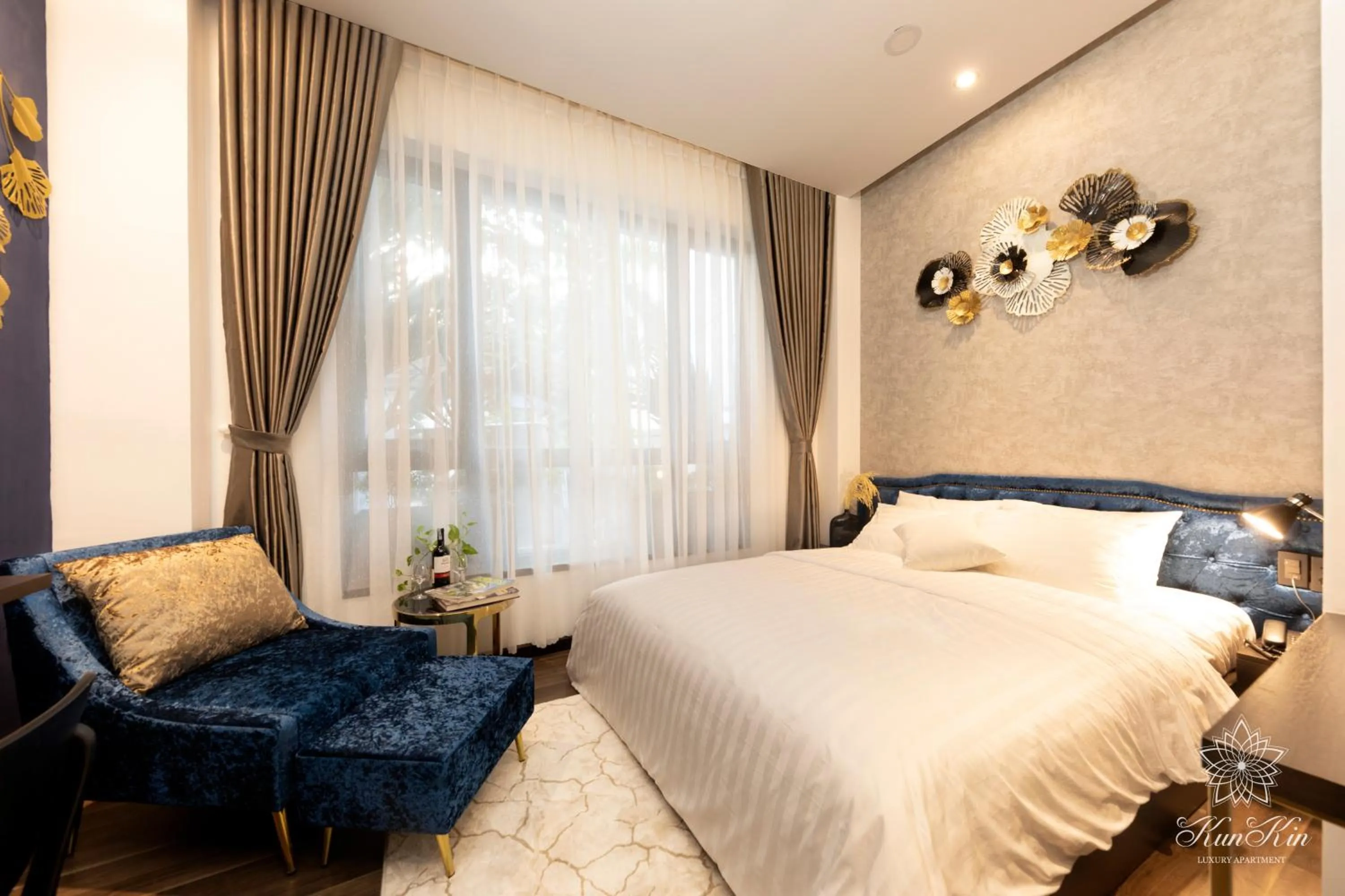 Bed in KunKin Luxury Hotel & Apartment