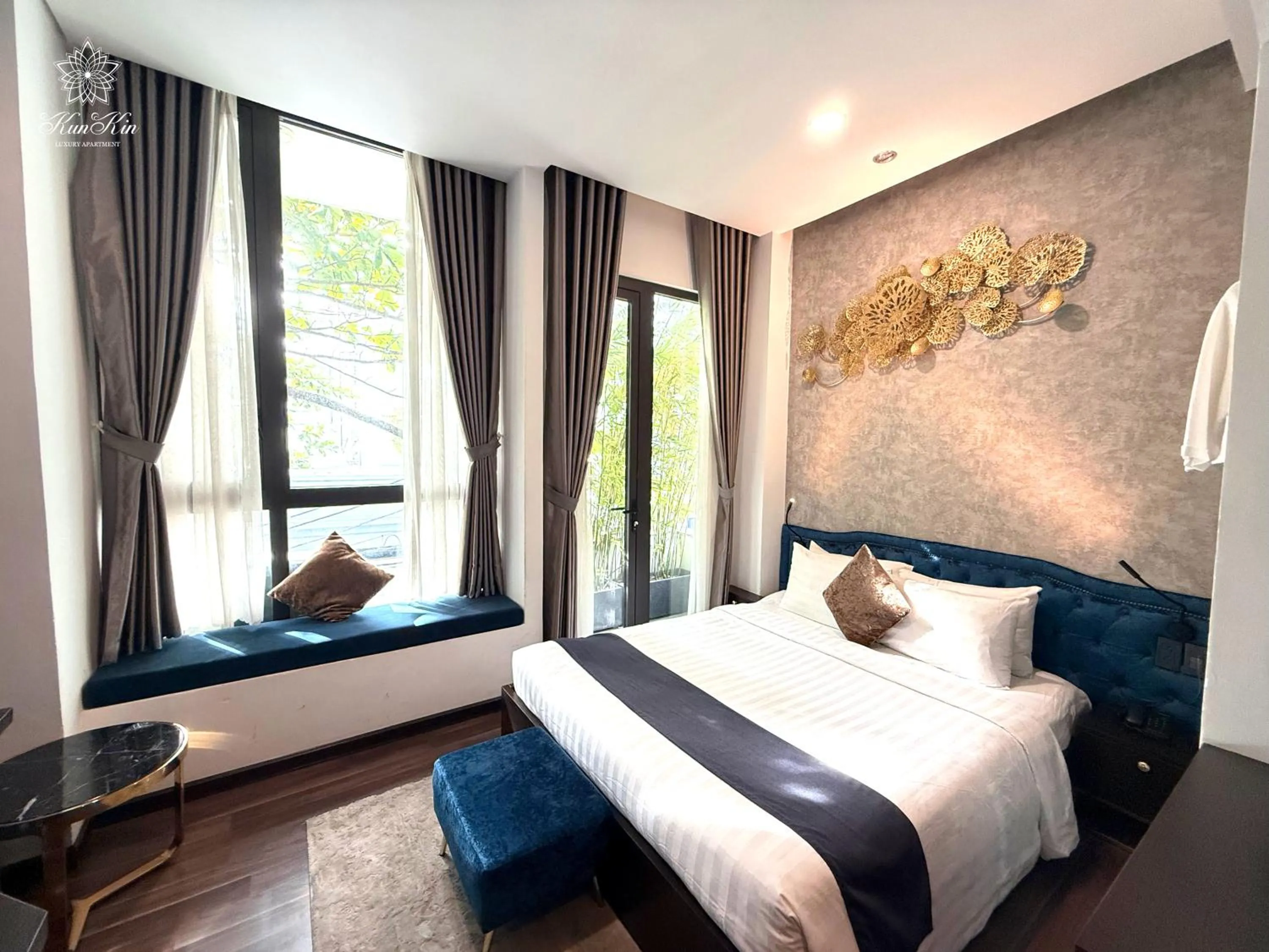 Bed in KunKin Luxury Hotel & Apartment