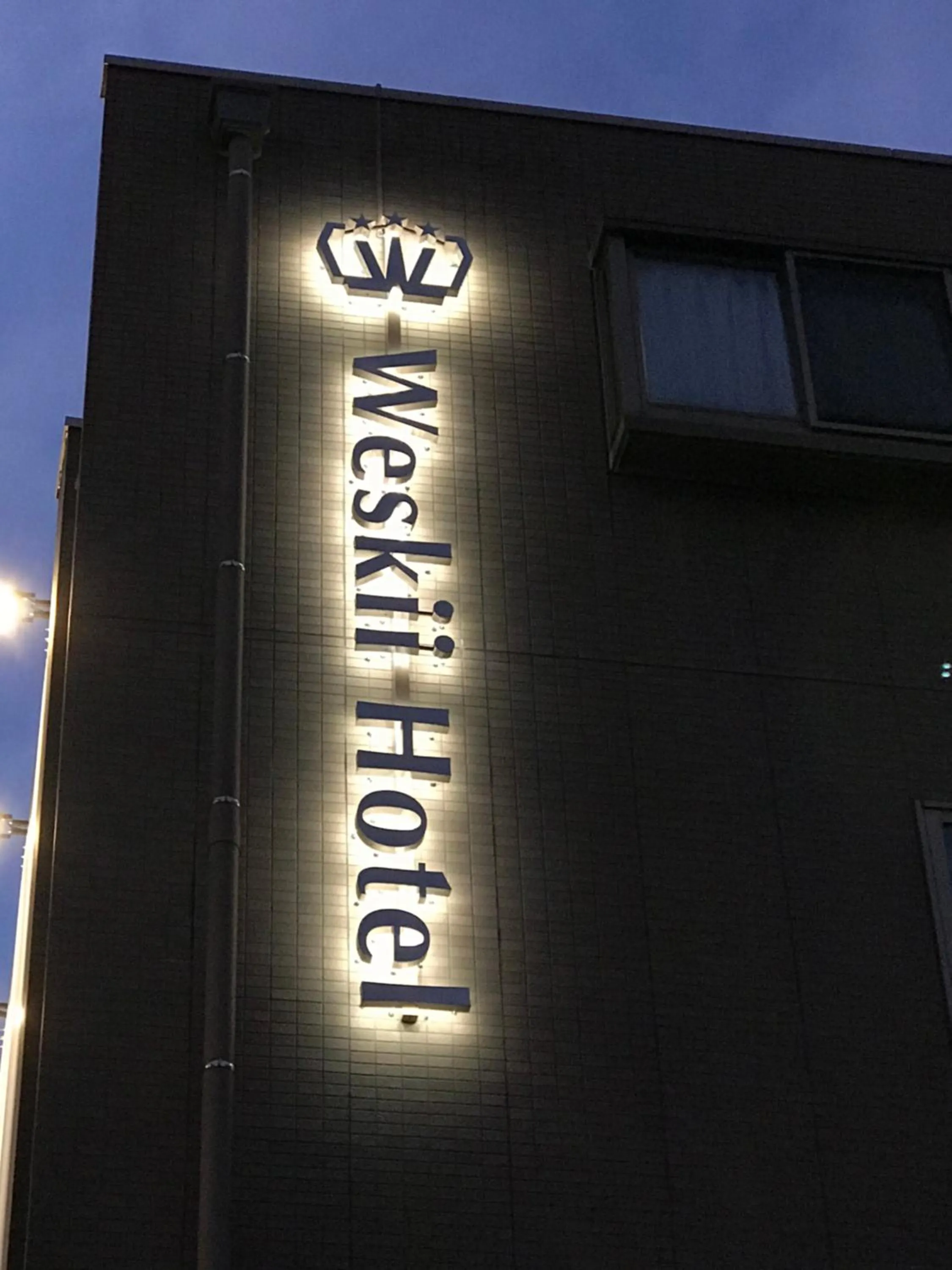 Property logo or sign in Weskii Hotel