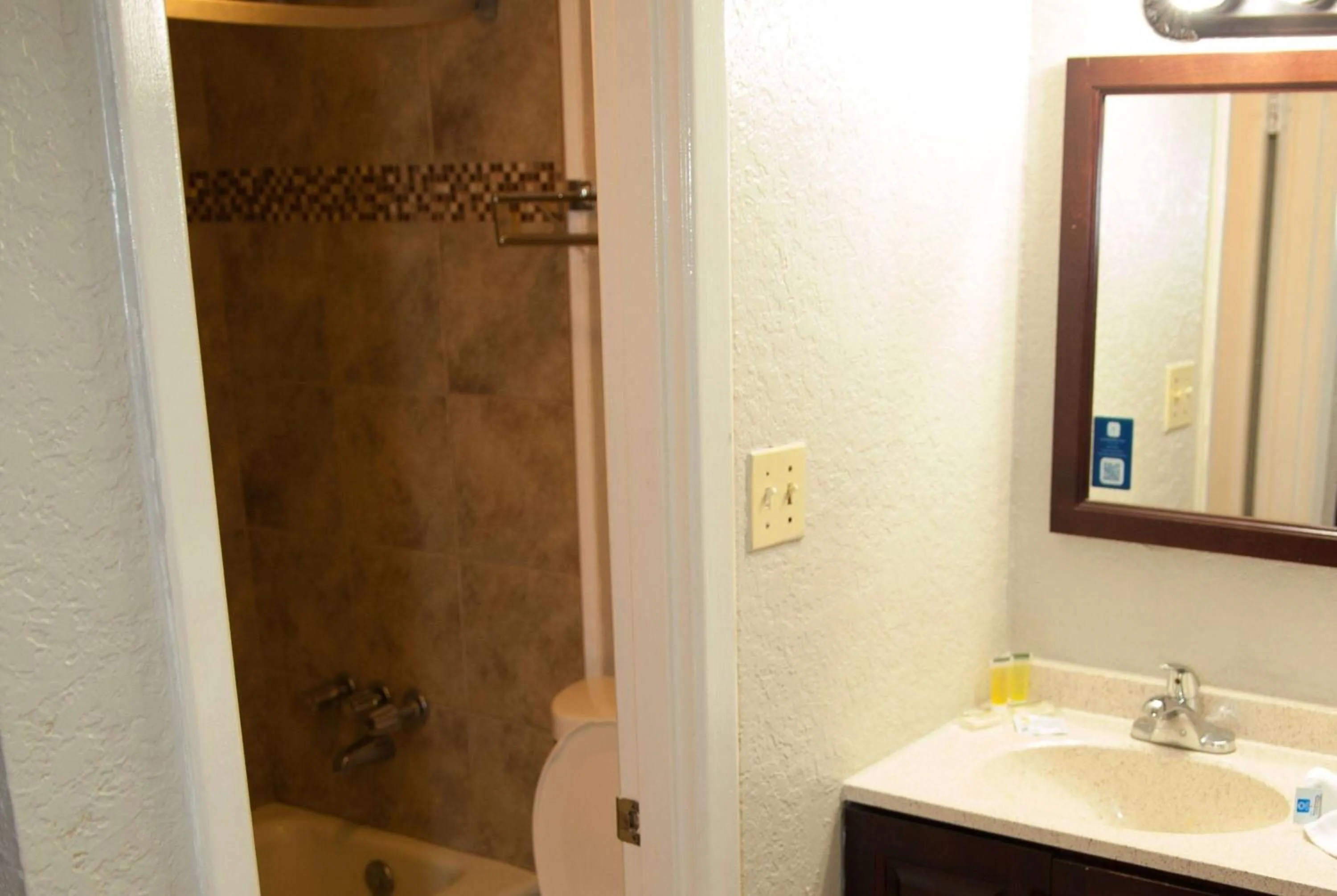 Bathroom in Days Inn by Wyndham Cocoa Cruiseport West At I-95/524