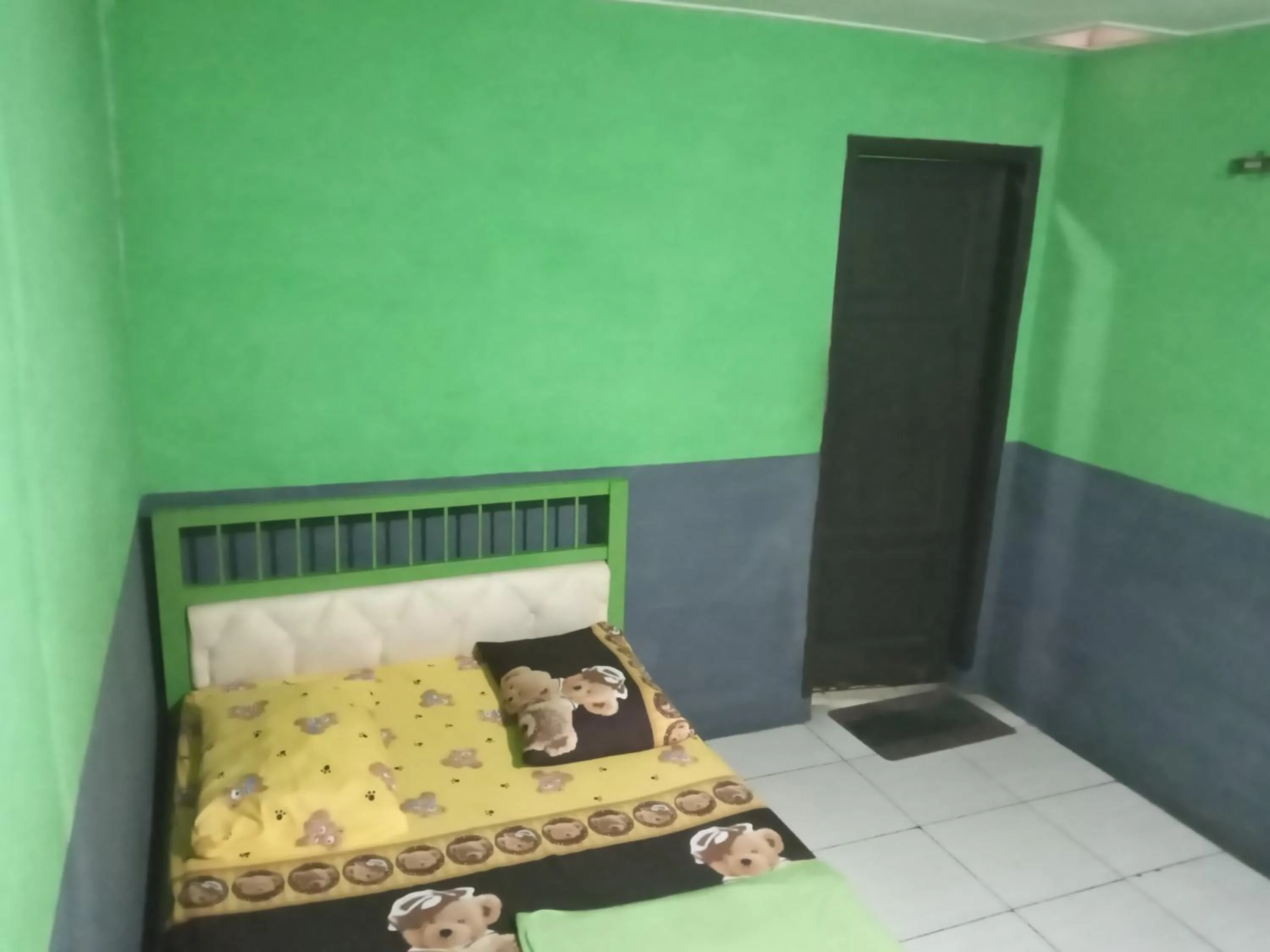 Bed in Penginapan 99