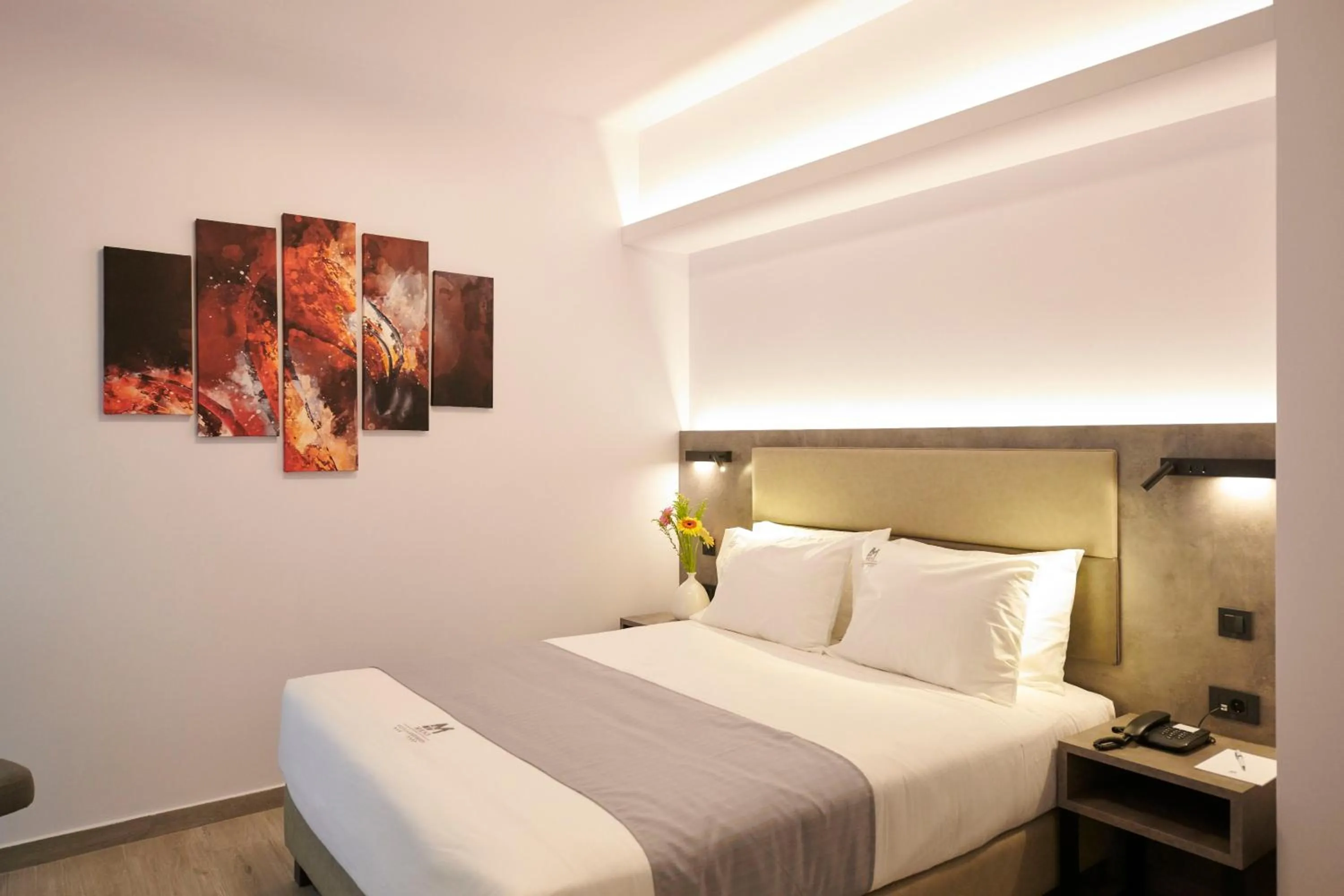 Bed in Meni Hotel & Apartments UNDER NEW MANAGEMENT