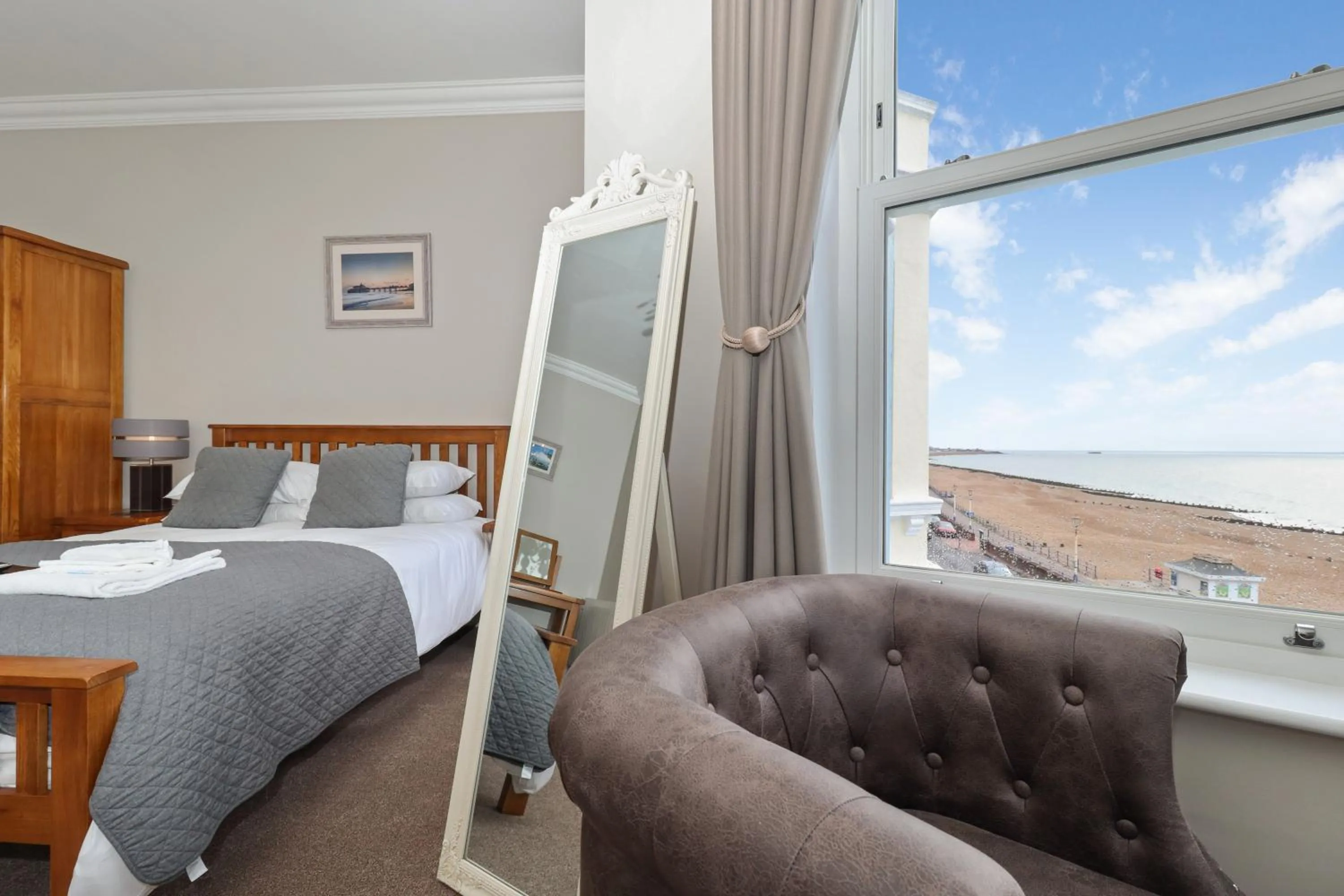 Seating area, Bed in Beach Front Guest House
