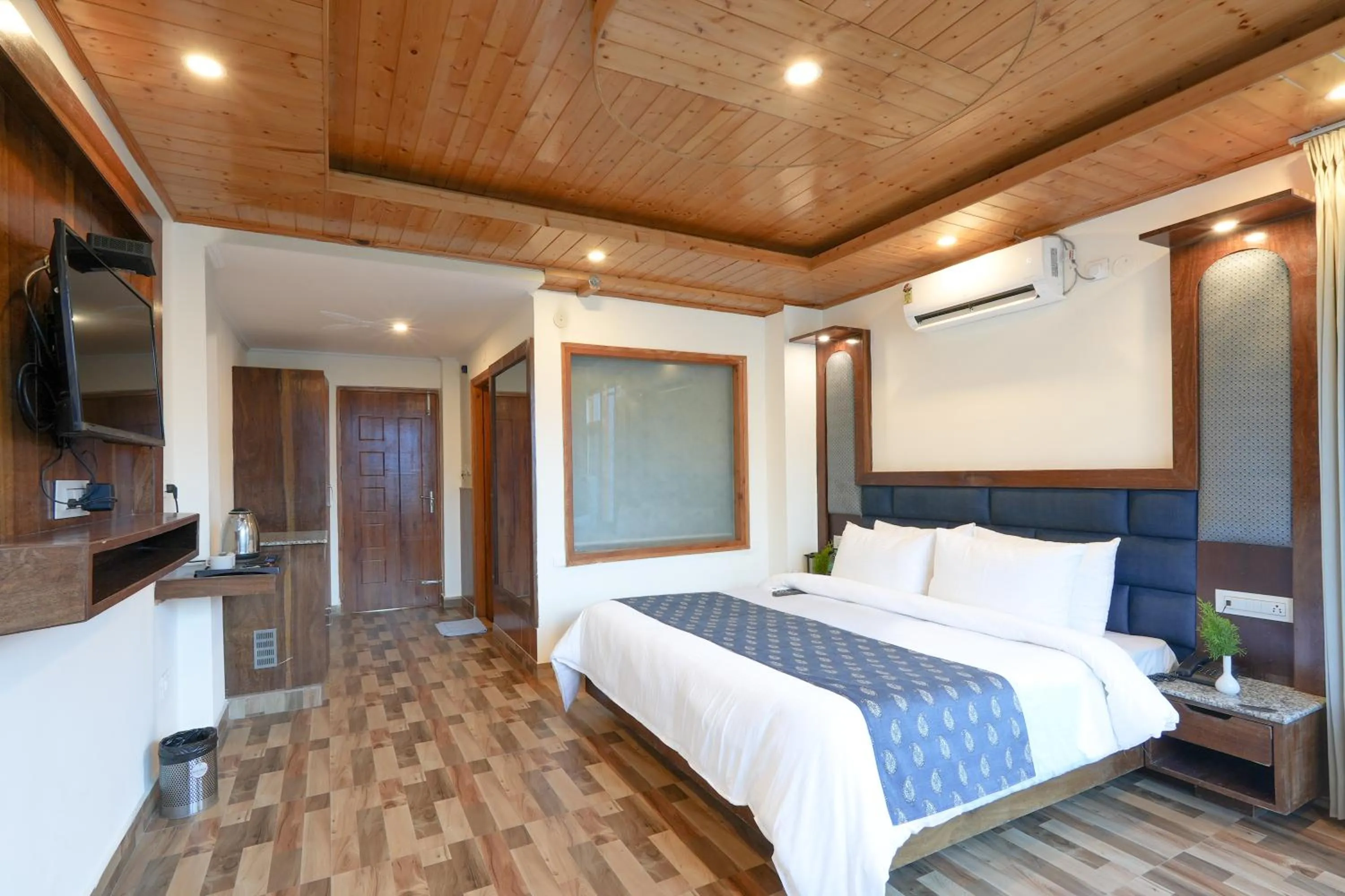 Bed in Snow City's Montana Blues Resort Manali - Heated & Air-Cooled Stay