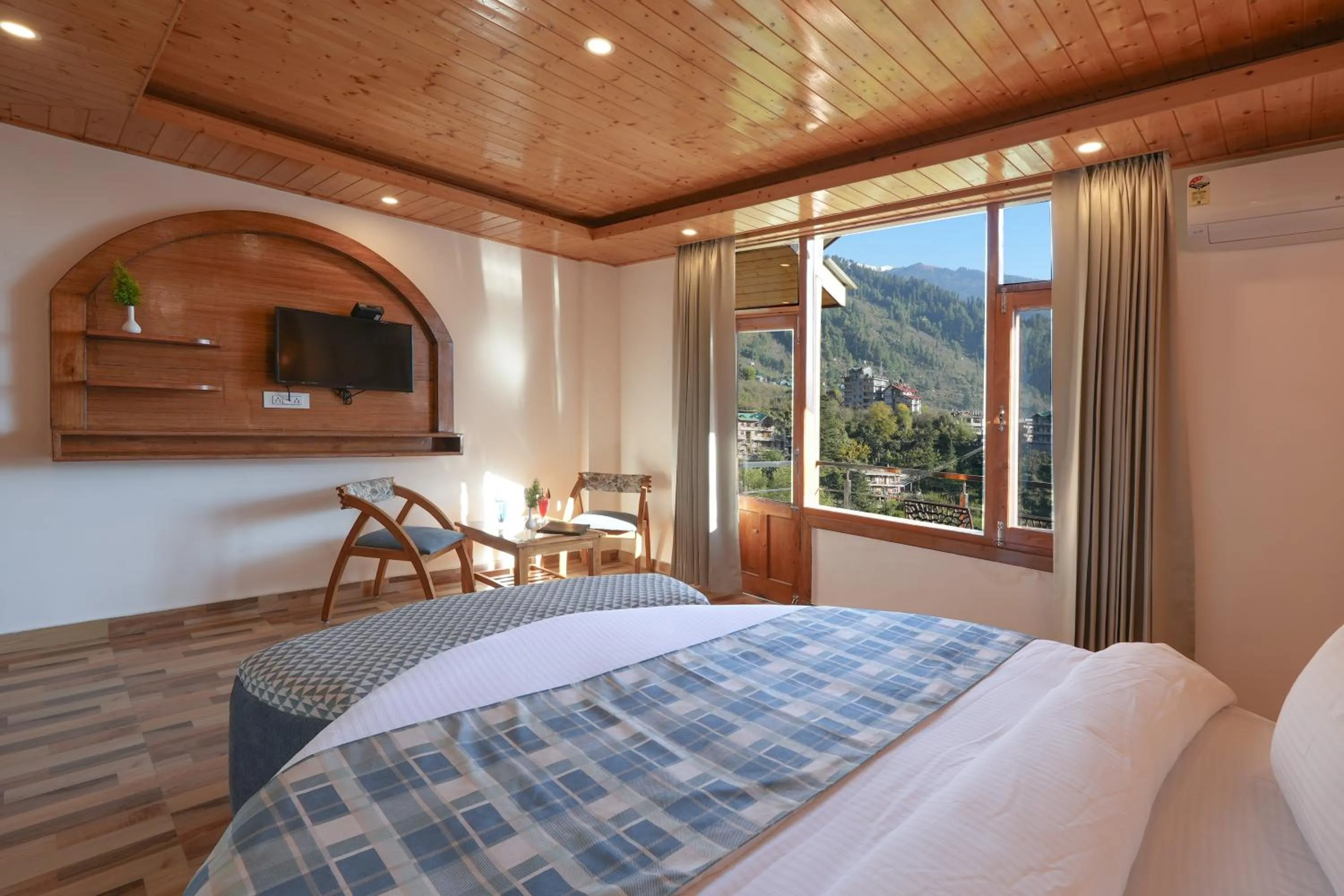 Bed in Snow City's Montana Blues Resort Manali - Heated & Air-Cooled Stay