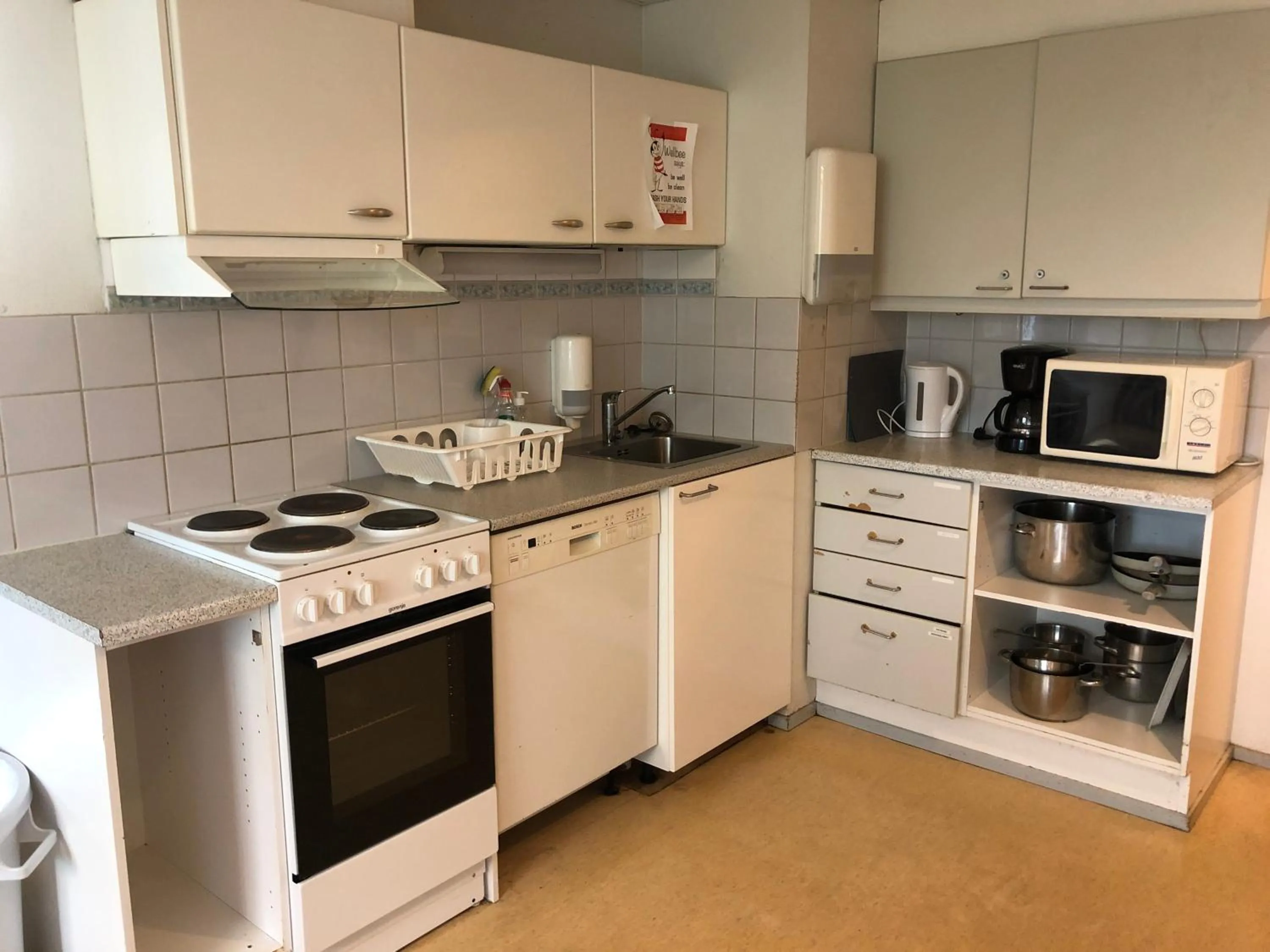 Communal kitchen in West Side Hotel