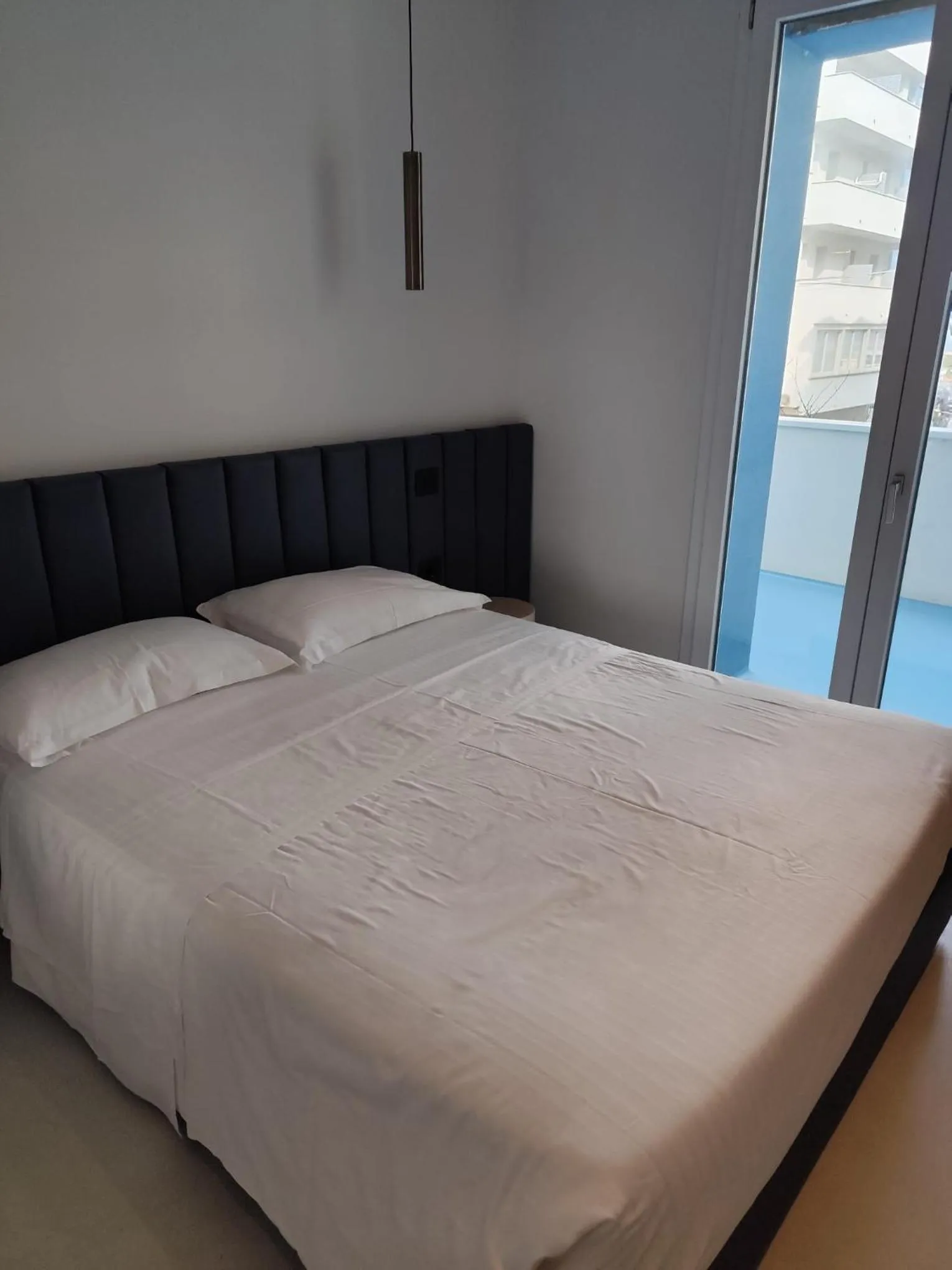 Bed in Gabbiano Suites