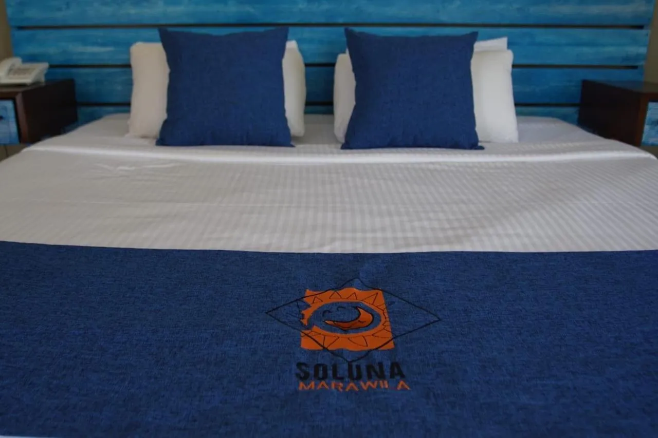 Bed in SOLUNA BEACH RESORT