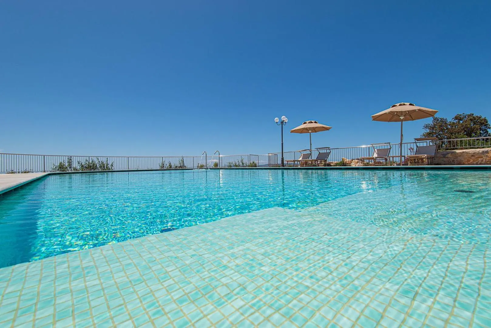 Swimming pool in Castello Bonaria Wine & Spa Resort