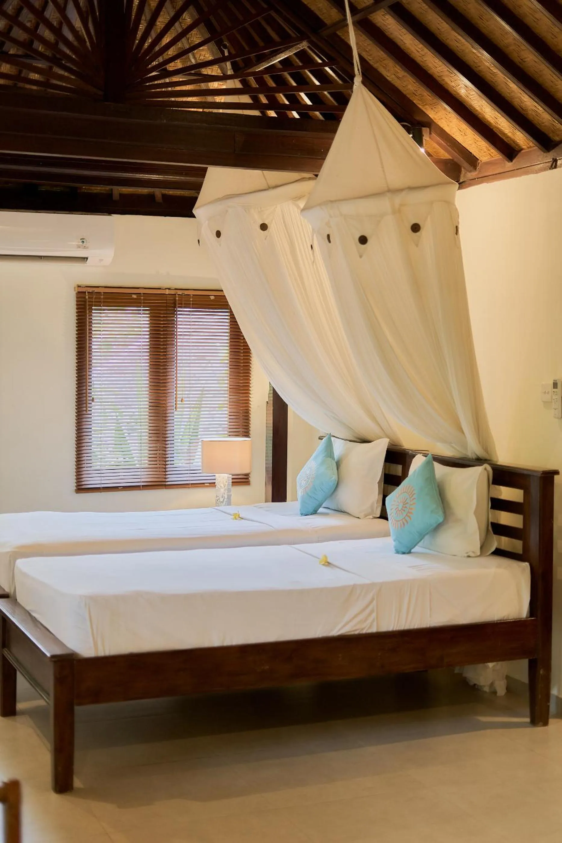 Bed in Sama's Cottages and Villas