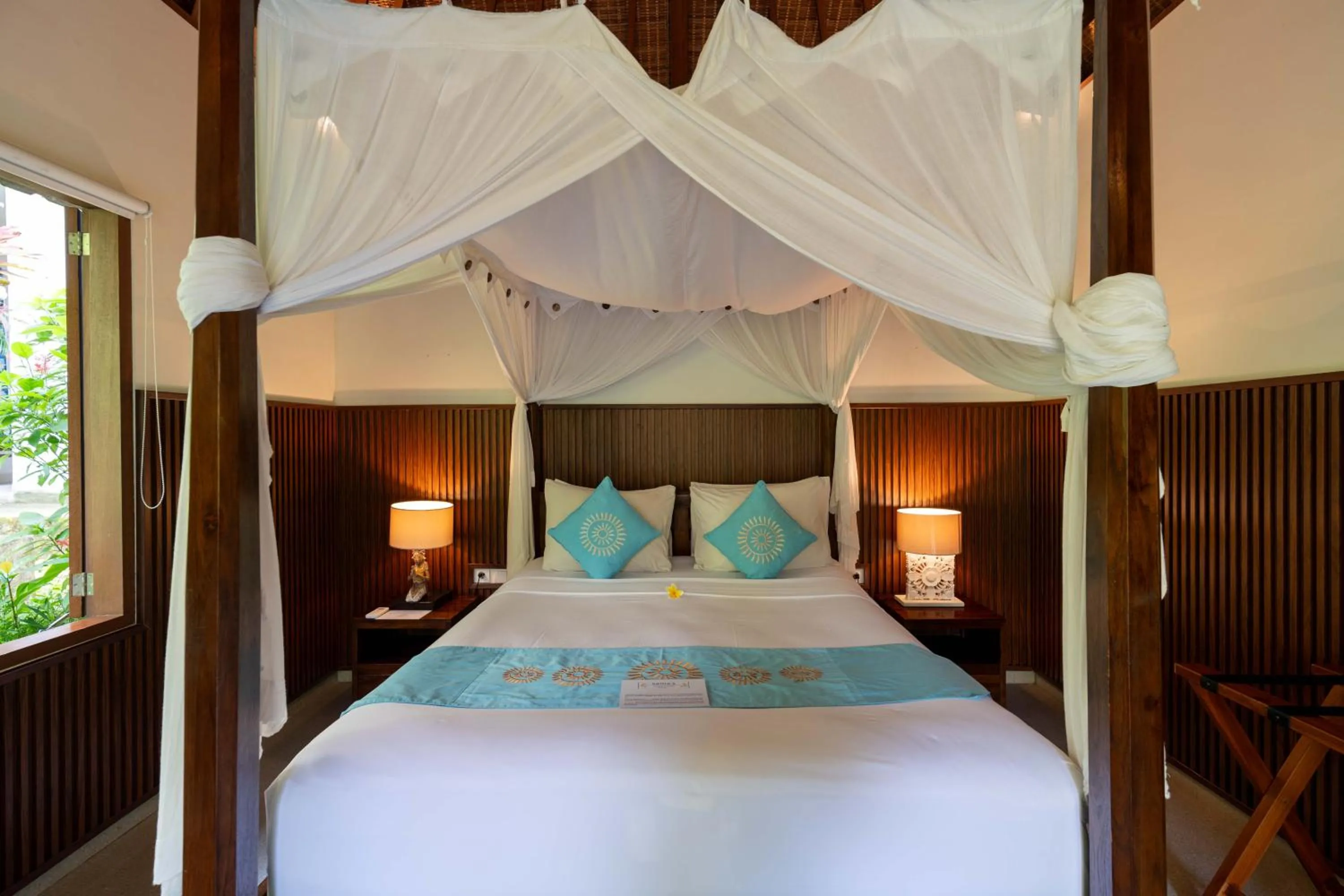 Bed in Sama's Cottages and Villas