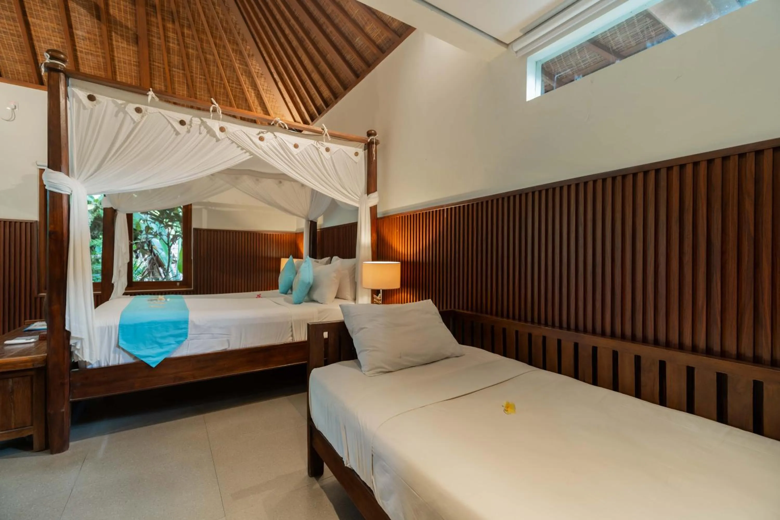 Bed in Sama's Cottages and Villas