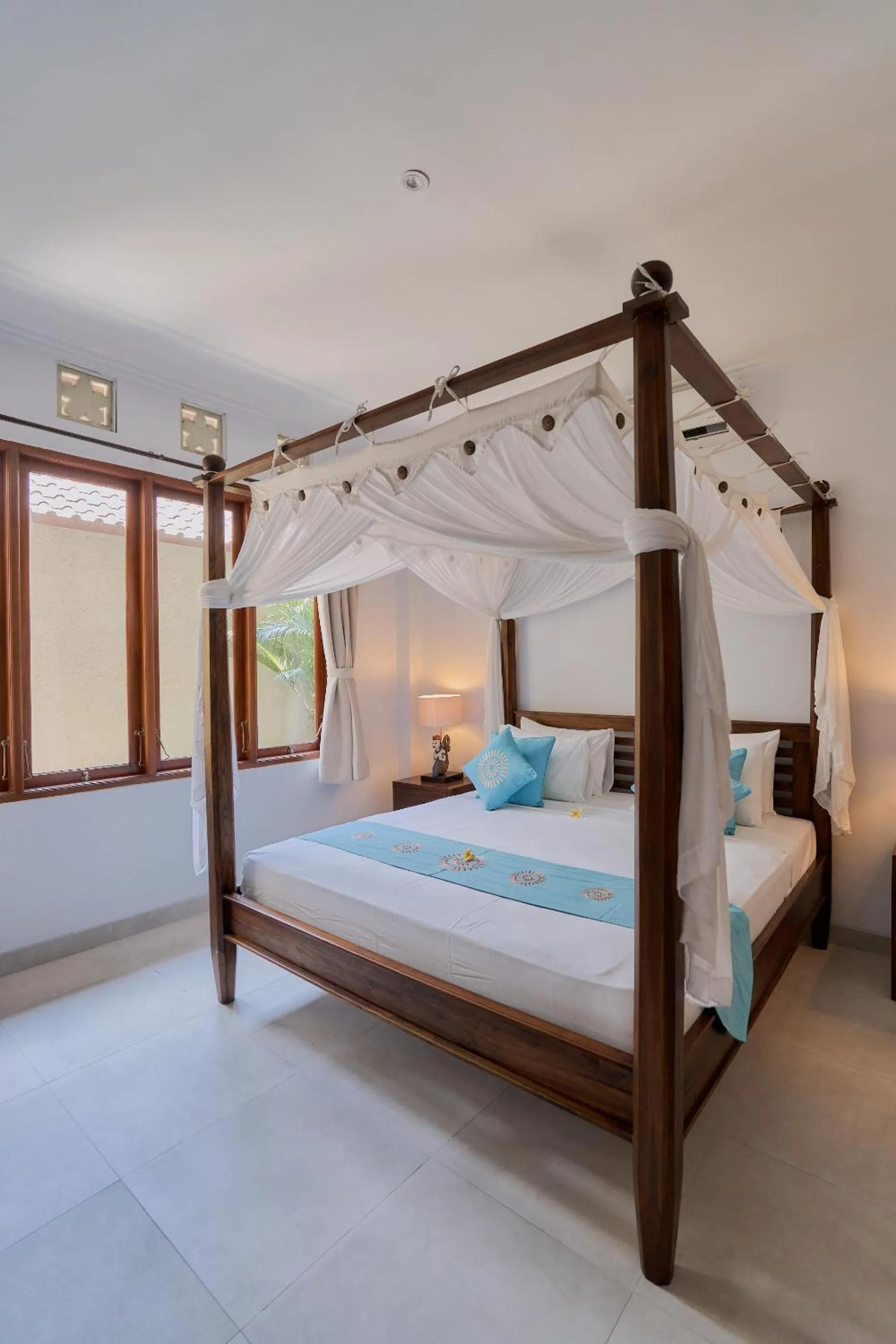 Bed in Sama's Cottages and Villas