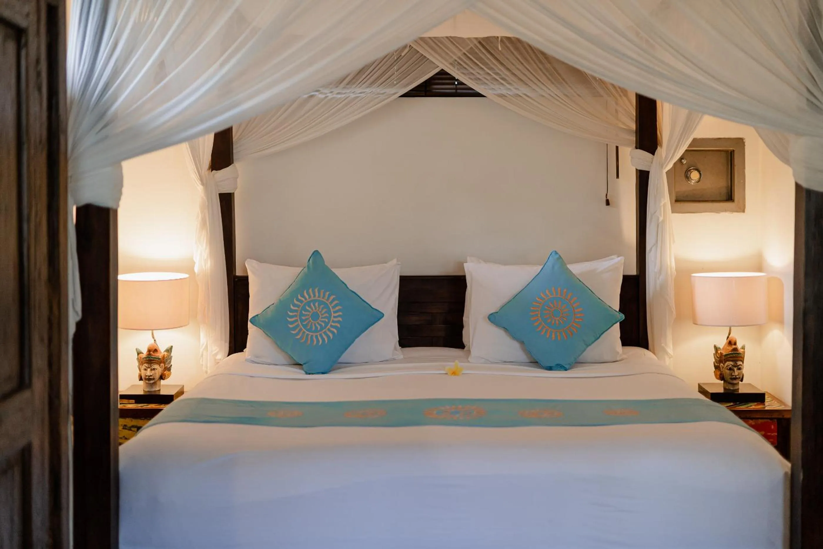 Bed in Sama's Cottages and Villas