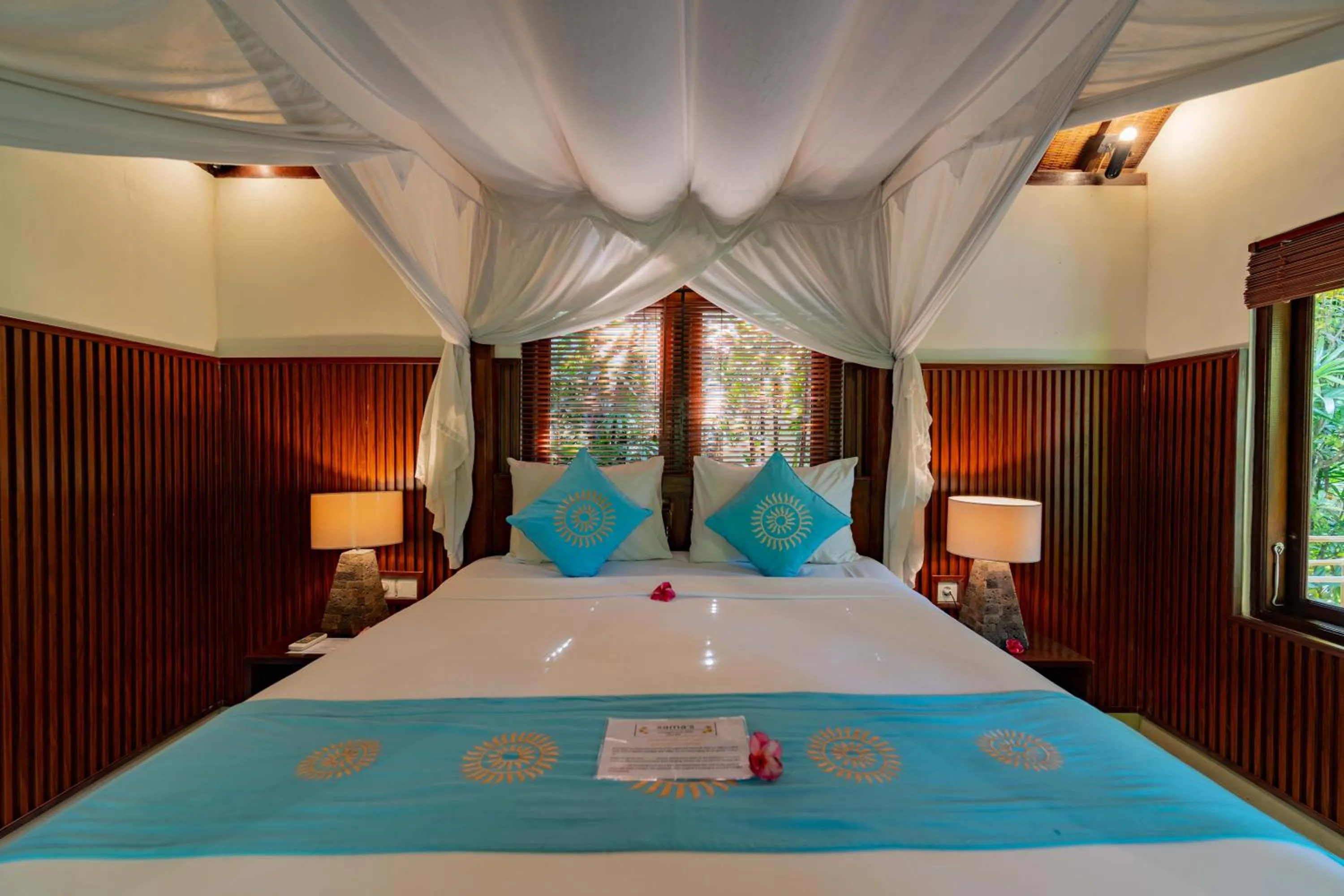 Bed in Sama's Cottages and Villas