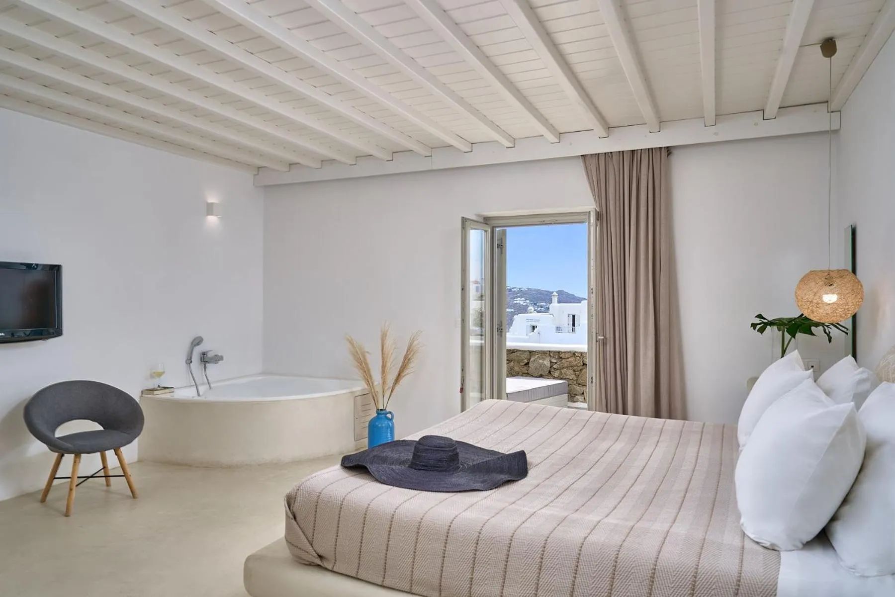 Bed in Paolas Τown Boutique Hotel