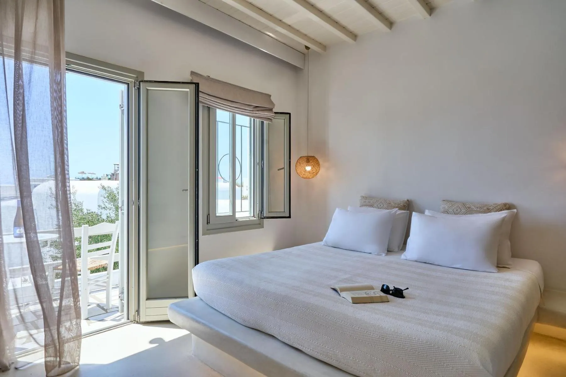 Bed in Paolas Τown Boutique Hotel