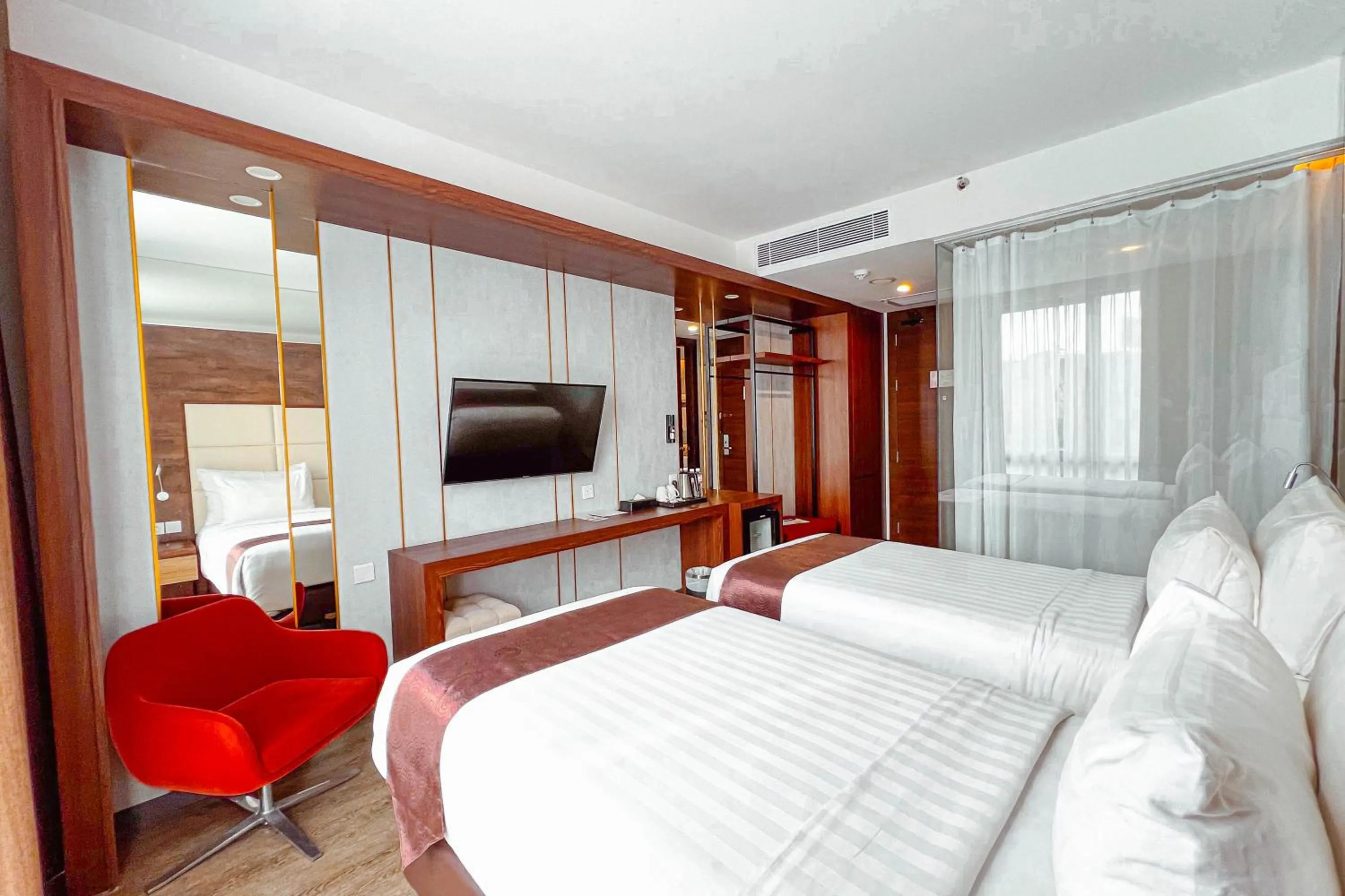 Bed in Asialink Hotel Batam by Prasanthi