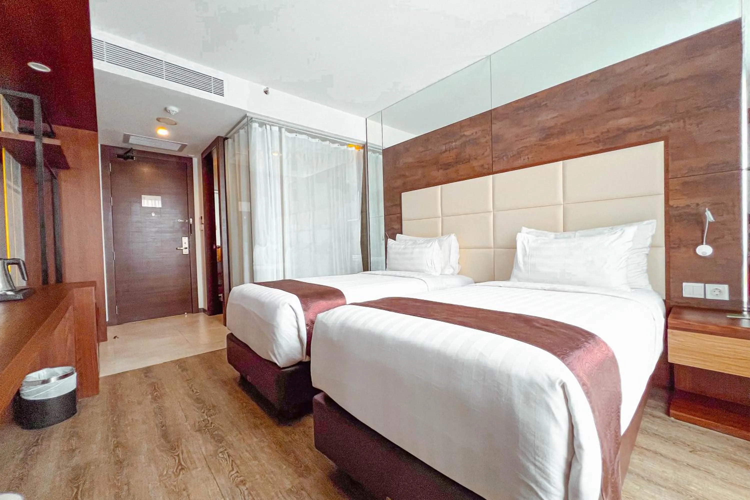 Bed in Asialink Hotel Batam by Prasanthi