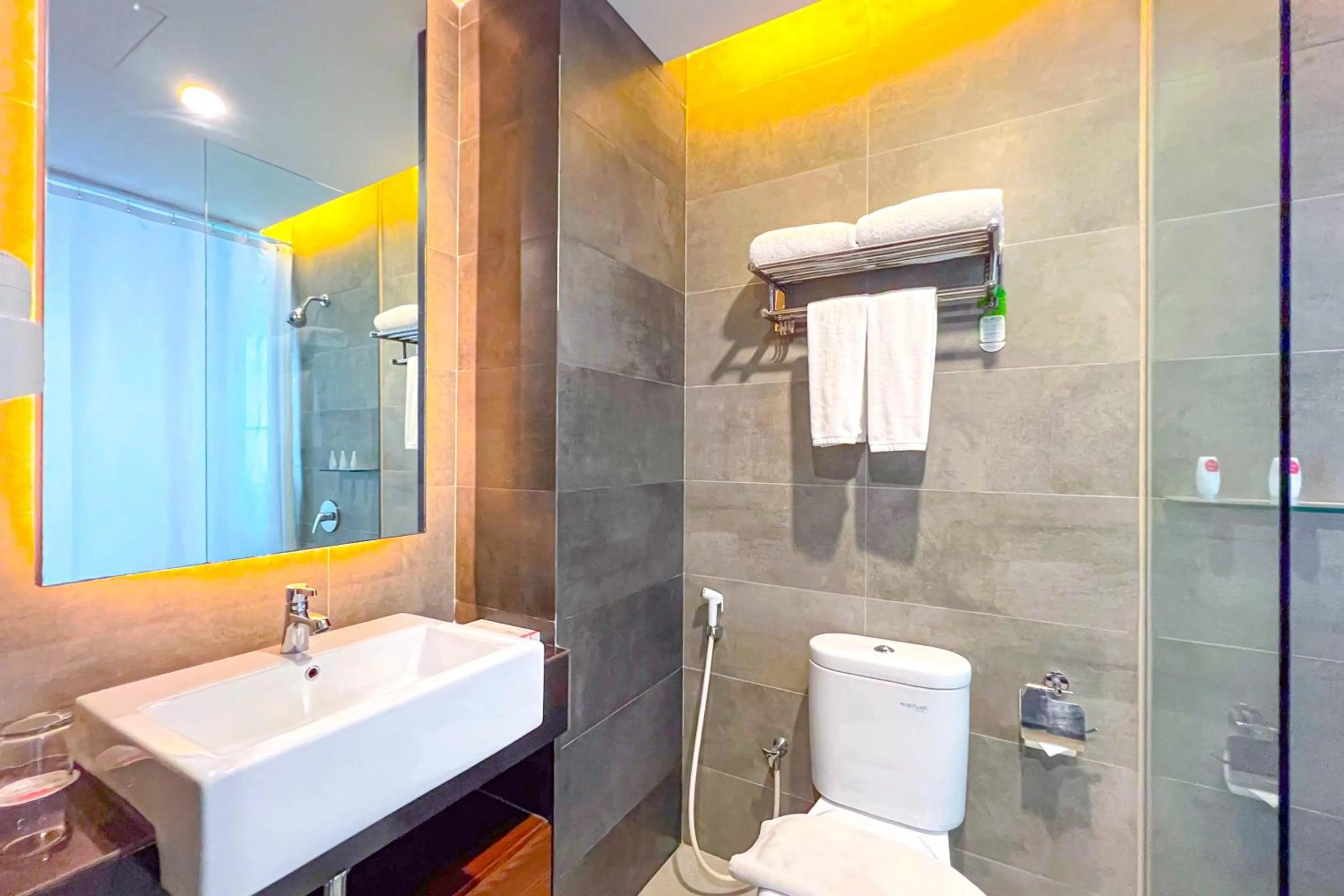 Bathroom in Asialink Hotel Batam by Prasanthi