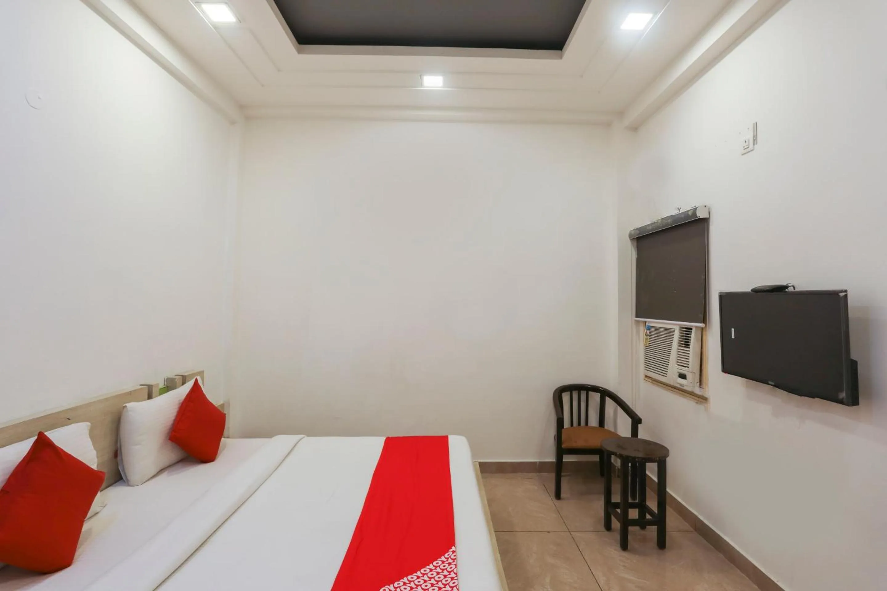 Bedroom in OYO Cladis Near Mall Of India