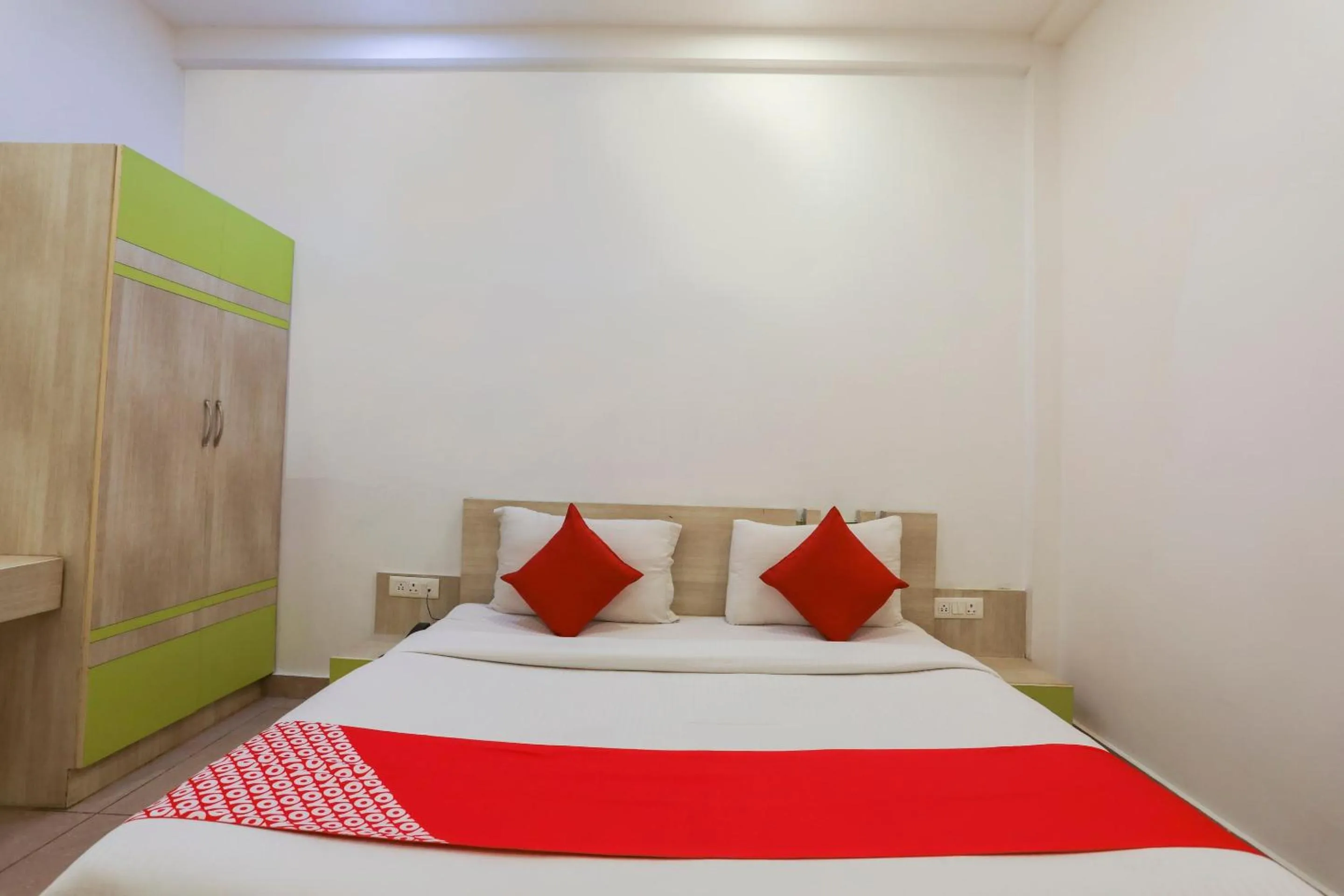 Bedroom in OYO Cladis Near Mall Of India