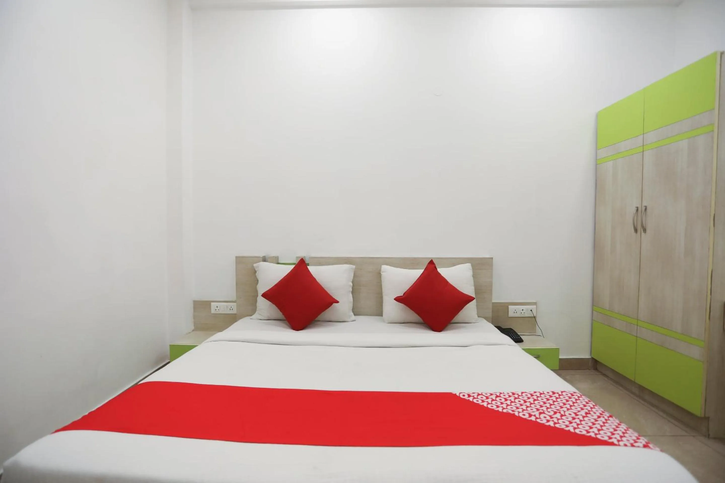 Bedroom in OYO Cladis Near Mall Of India