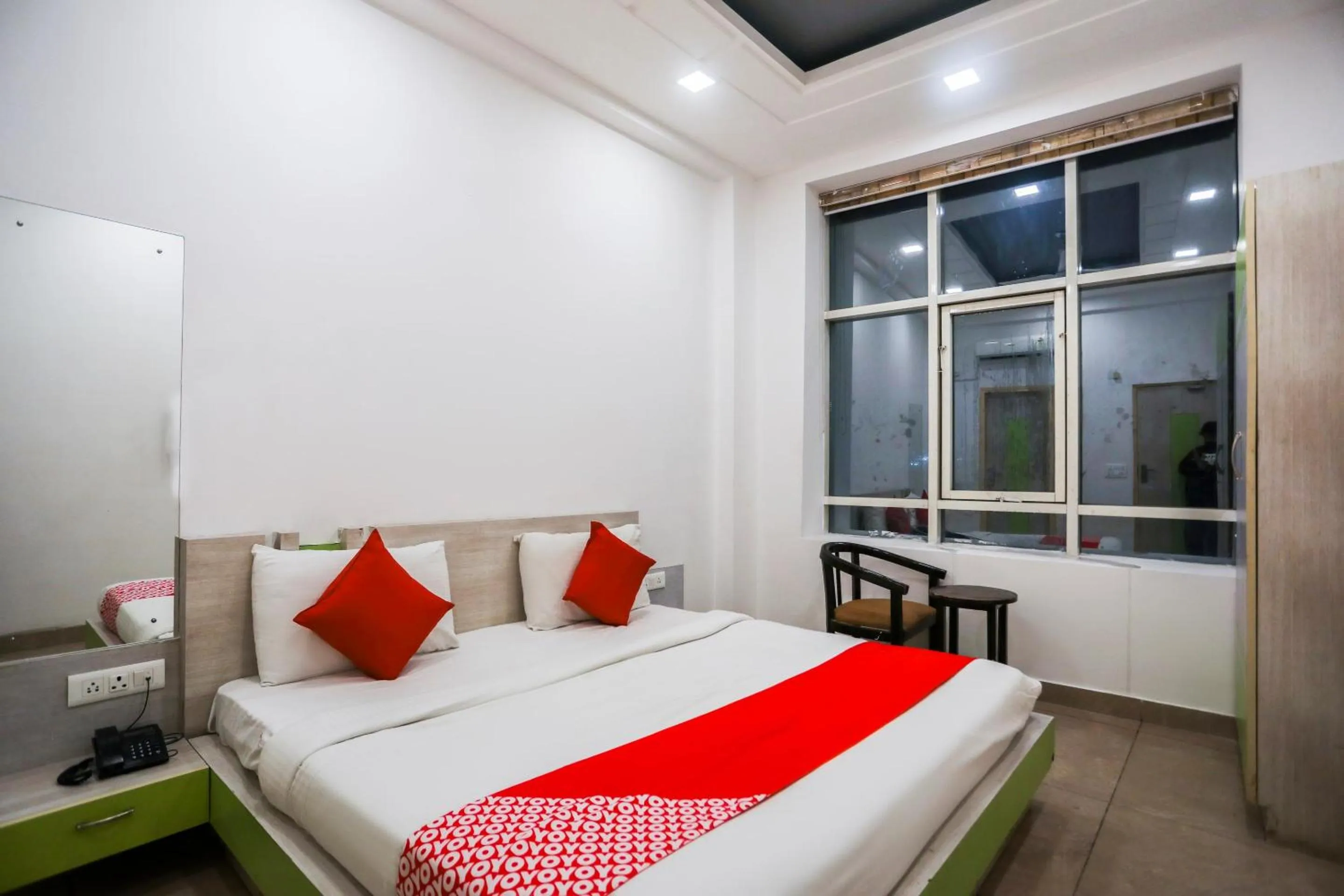 Bedroom in OYO Cladis Near Mall Of India