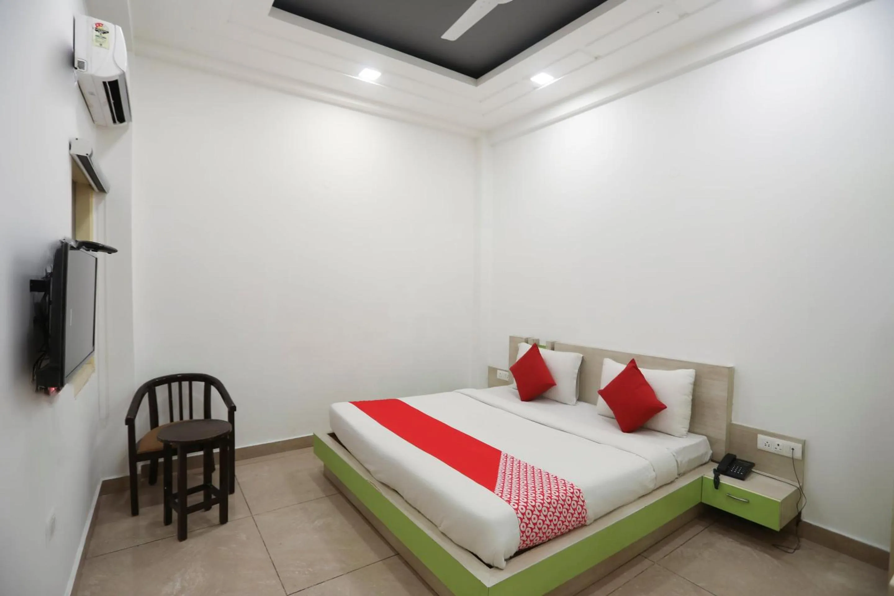 Bedroom in OYO Cladis Near Mall Of India