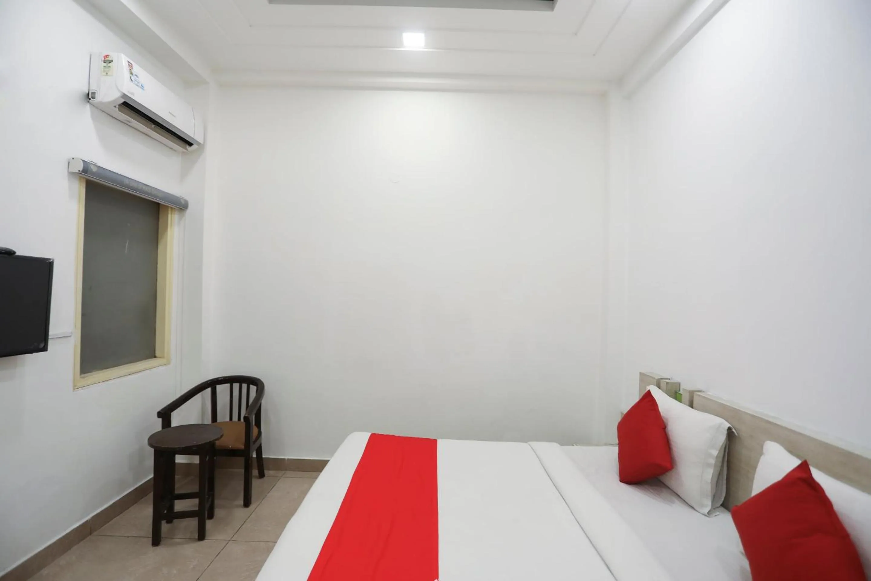 Bedroom in OYO Cladis Near Mall Of India