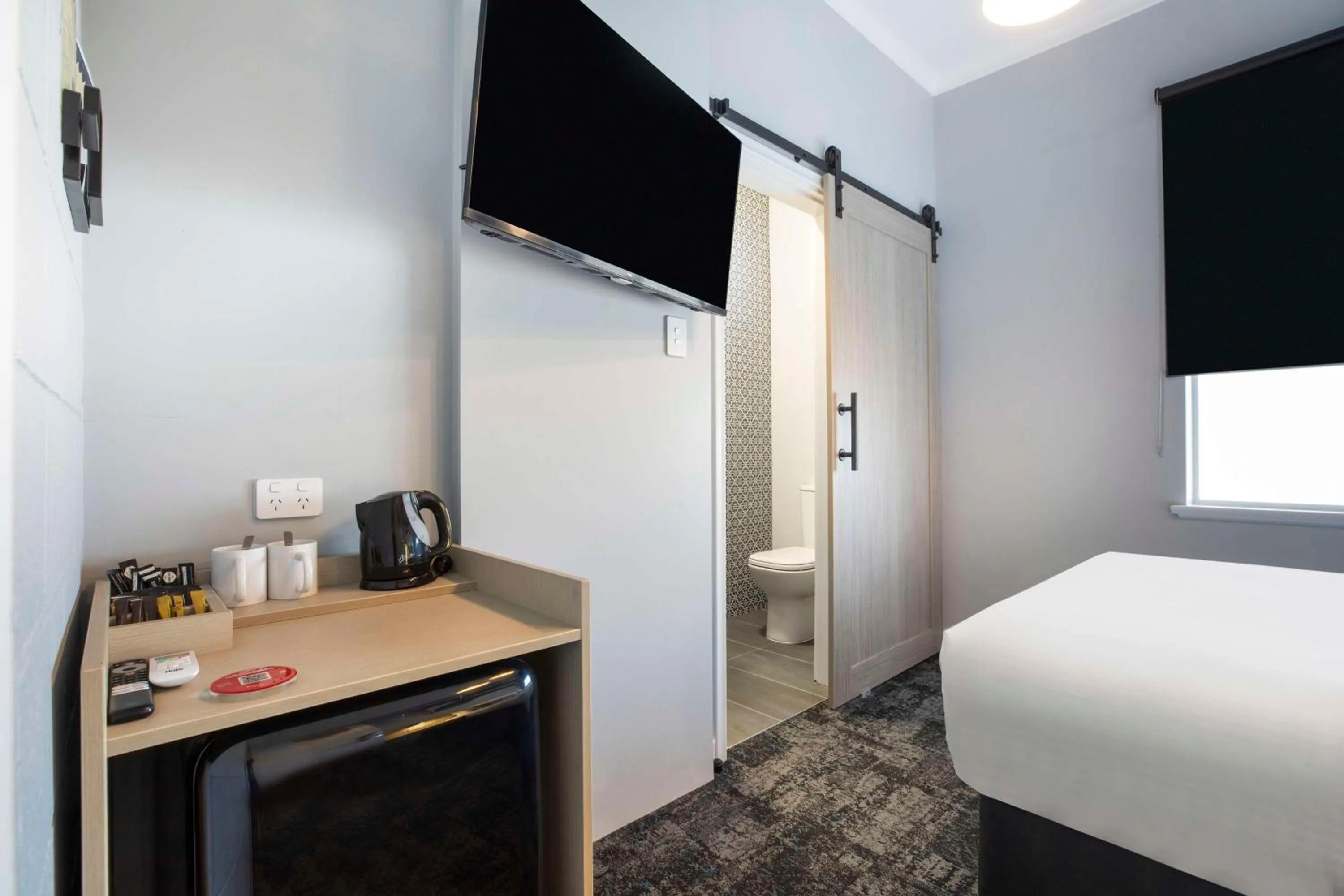 Bedroom, Bed in Nightcap at Rex Hotel